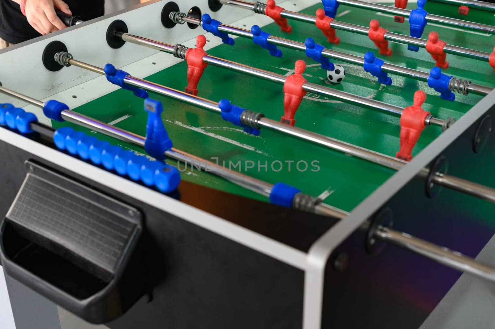Board game football, an active and developing game for motor skills, attentiveness and dexterity for children, a team game.