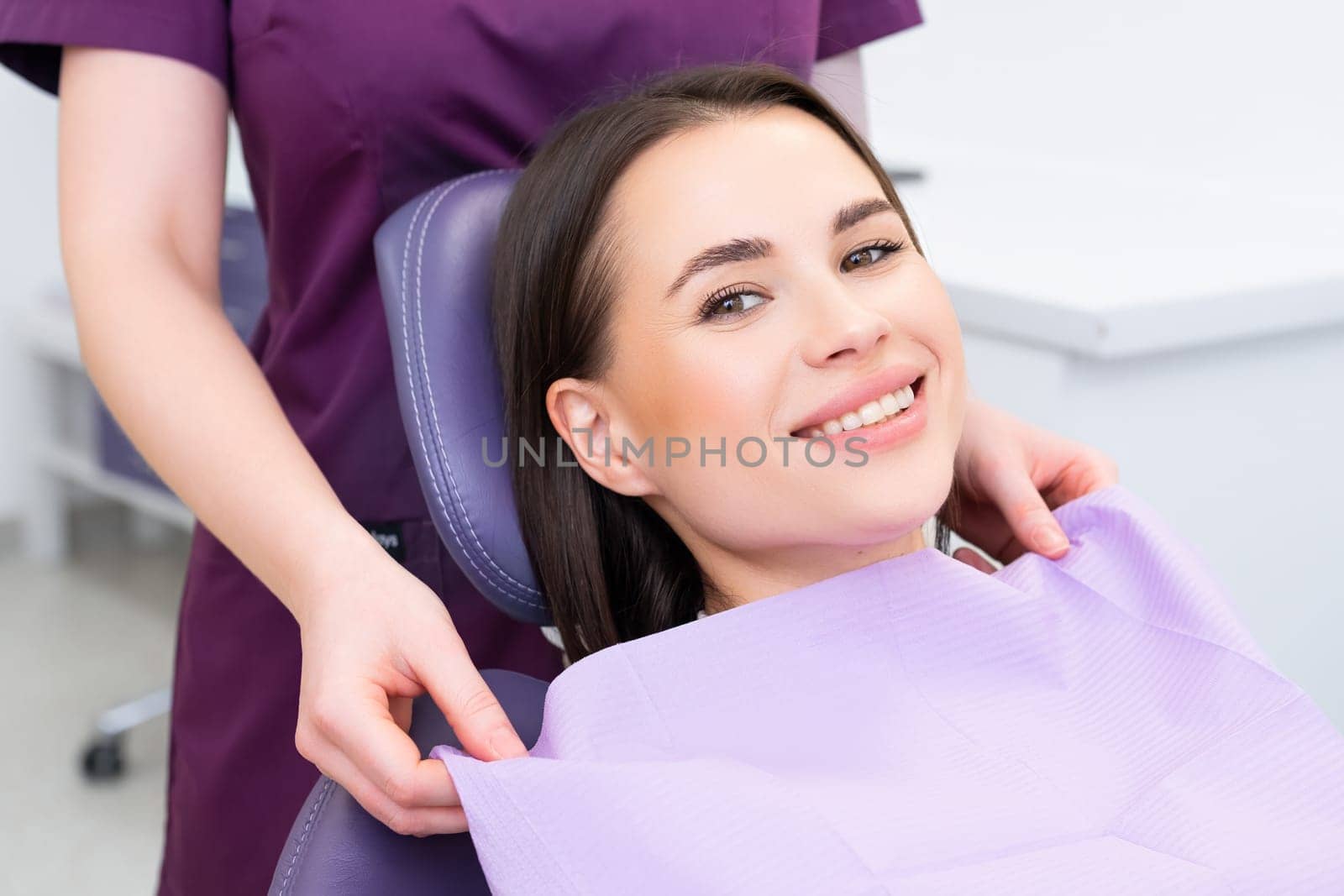 Portrait of young woman before teeth examination in the dental office
