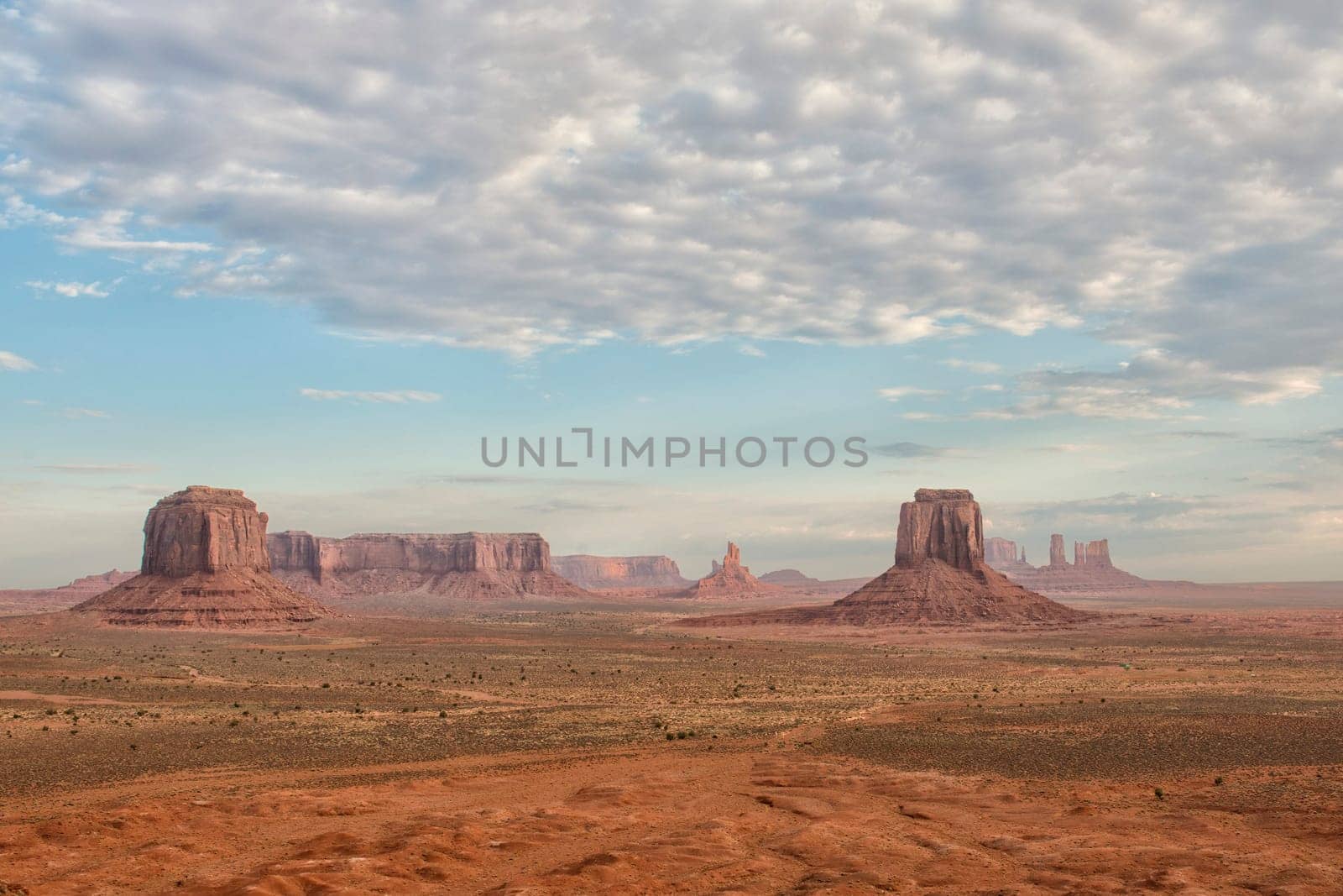 Monument Valley aerial view on cloudy sky and lights on mittens