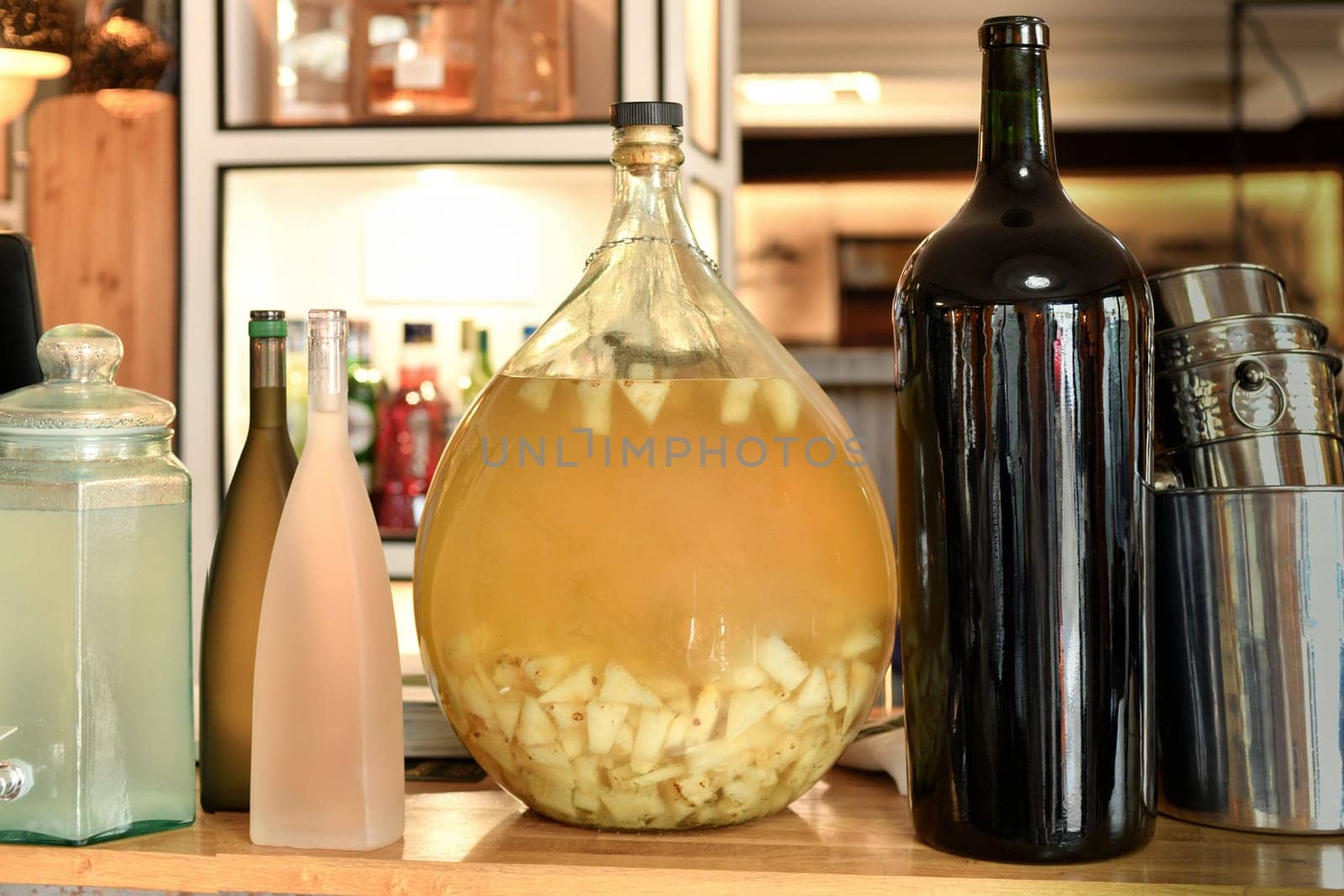 Pineapple beverage in the Jar with pineapple pieces Restaurant bar counter with alcohol