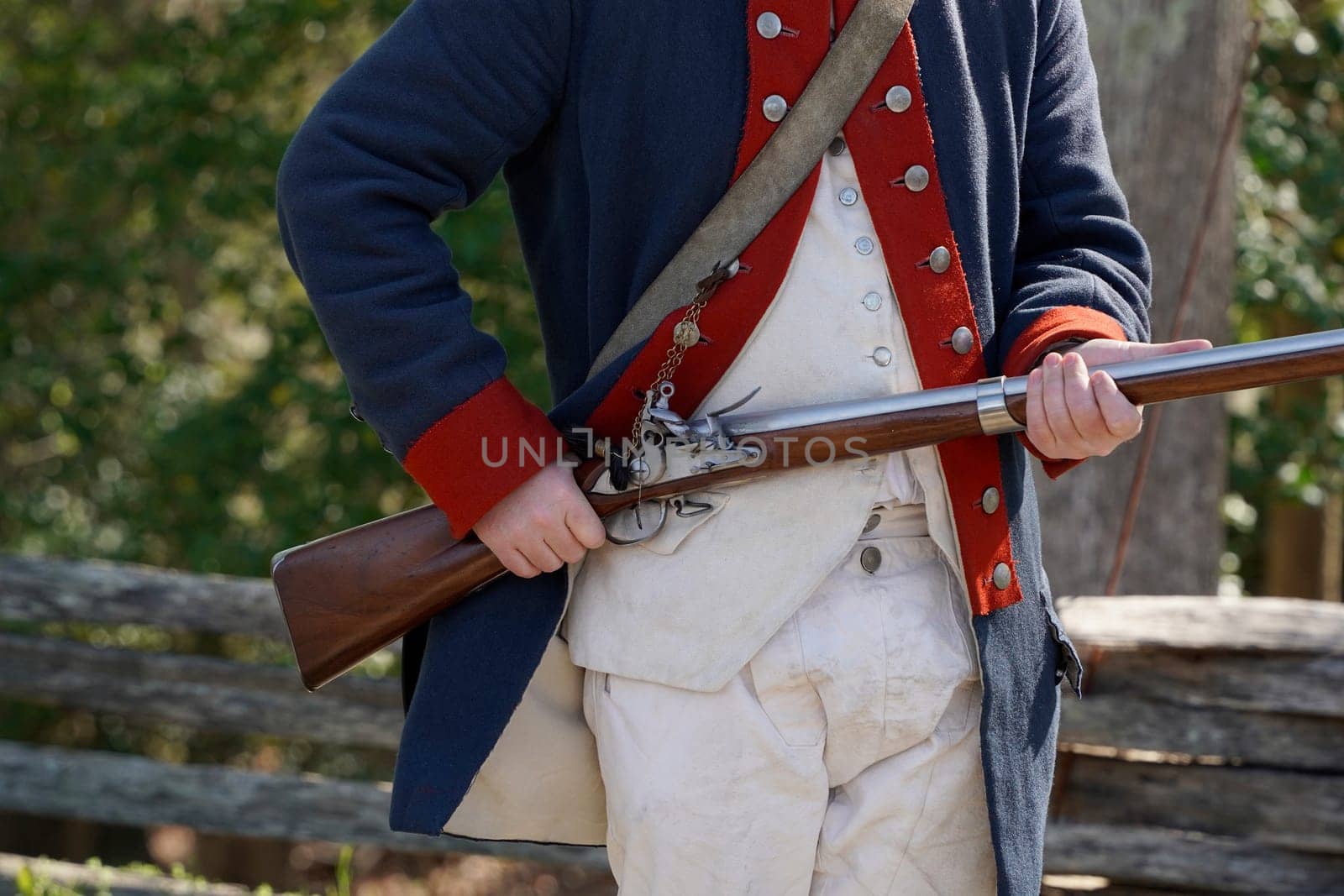 musket on hands of American Revolution british soldier settler in Yorktown, Virginia by AndreaIzzotti