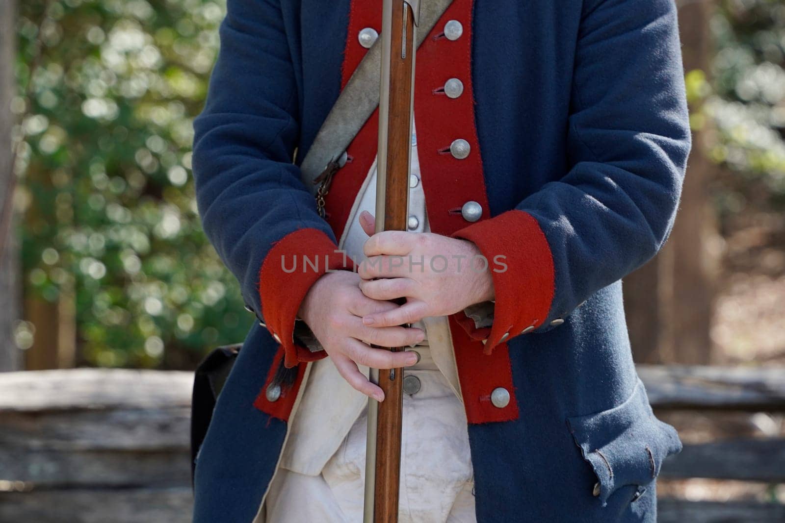 musket on hands of American Revolution british soldier settler in Yorktown, Virginia by AndreaIzzotti