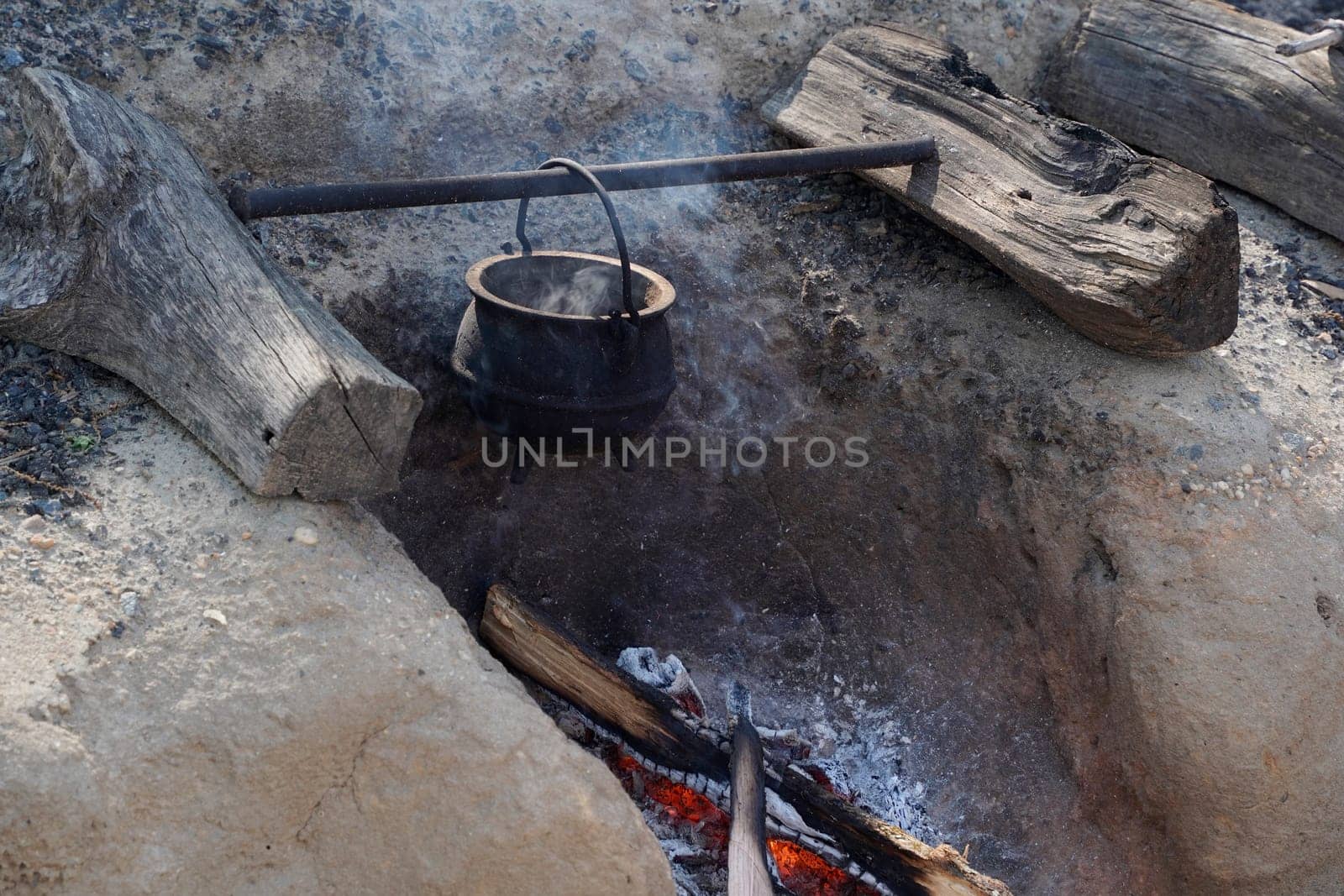 Water boiling on fire in camp of American Revolution british soldier settler in Yorktown, Virginia USA