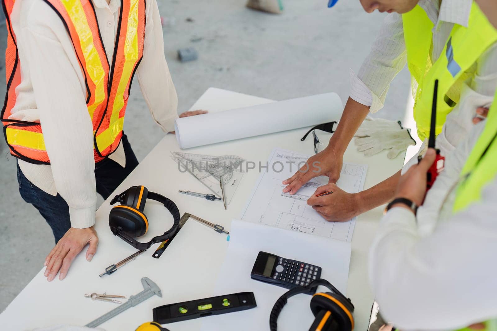 businesswoman hands using a calculator to check company finances and earnings and budget by itchaznong