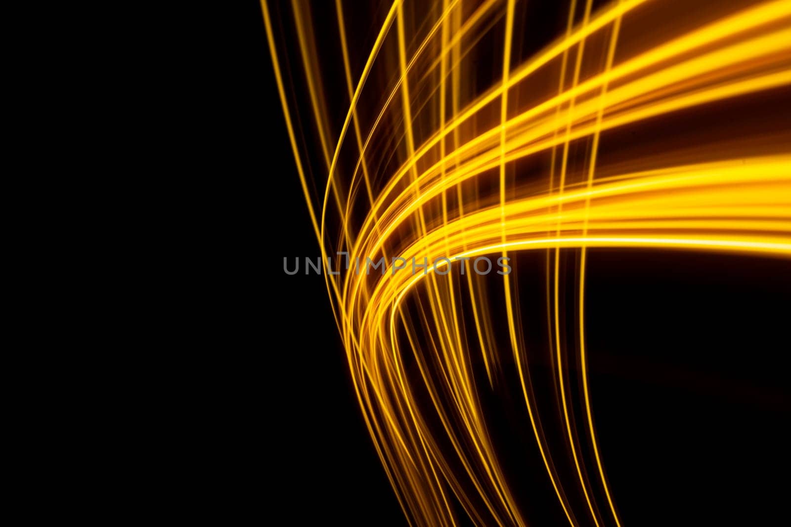 Long exposure photo capturing an electric yellow light trail on a dark background by PaulCarr
