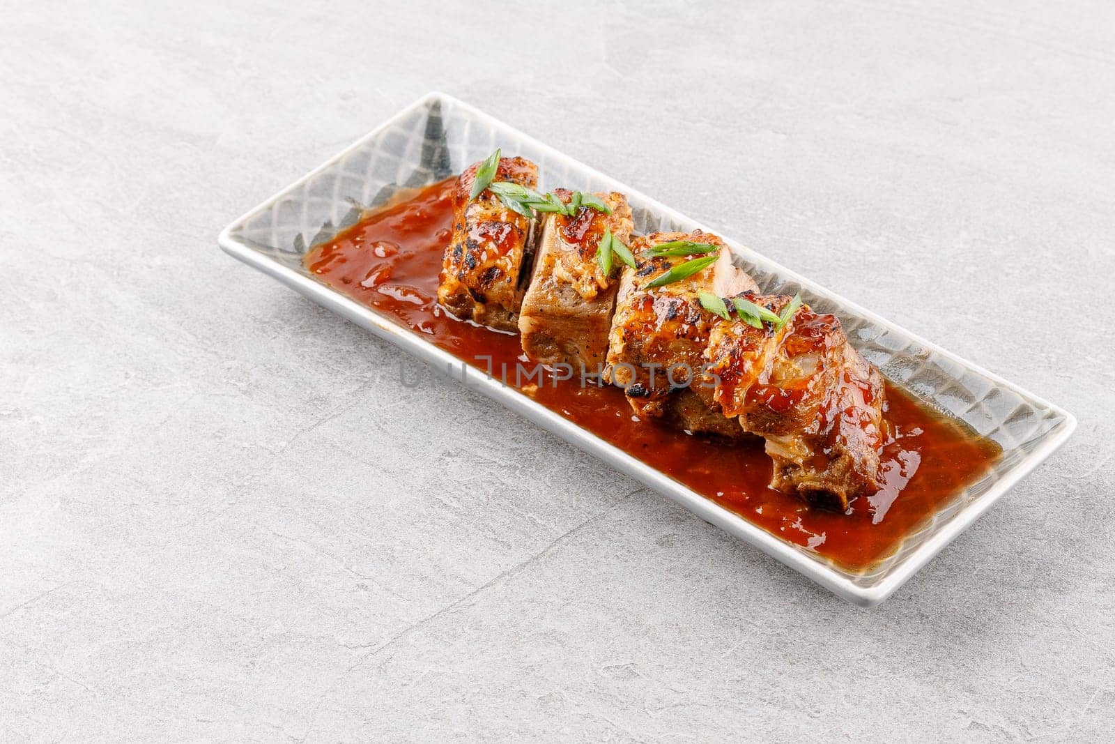 roasted appetizing pork on a stone background studio food photo