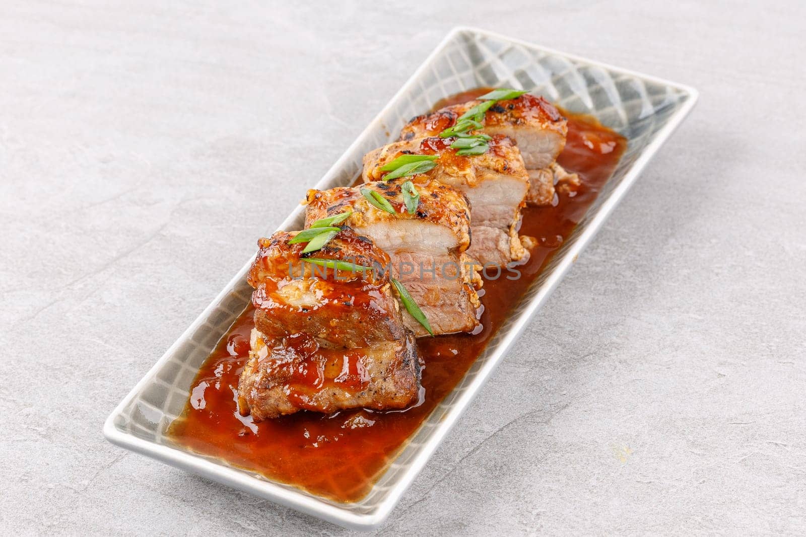 roasted appetizing pork on a stone background studio food photo 5