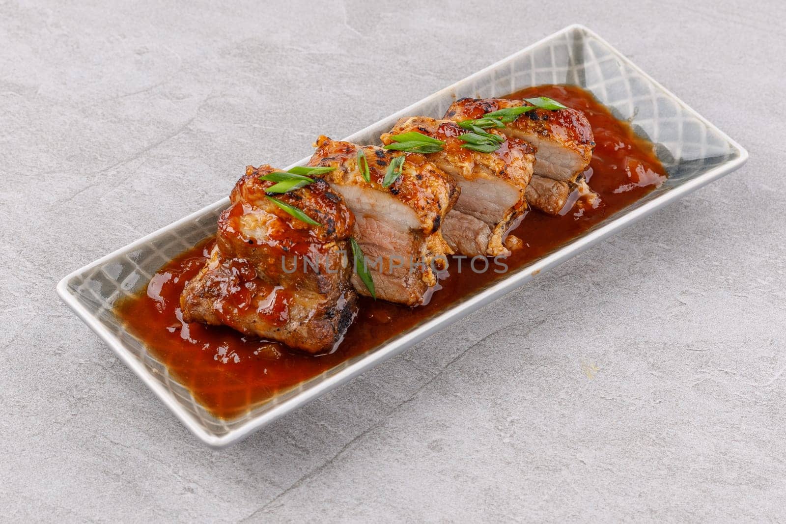 roasted appetizing pork on a stone background studio food photo 3