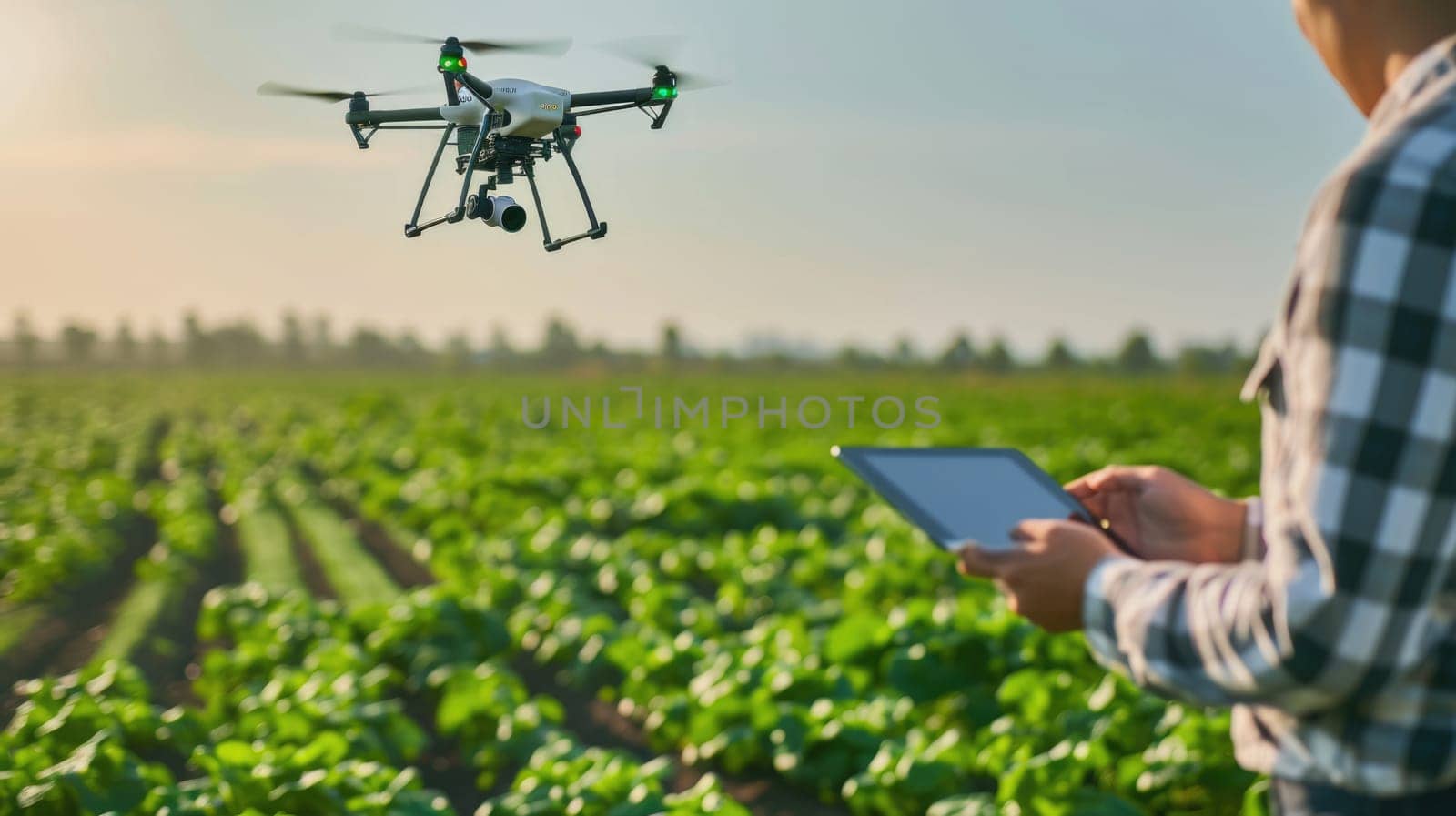 A woman flies a drone over a grassy field by making gestures AIG41 by biancoblue