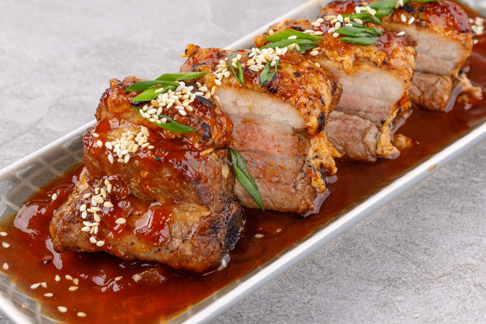 roasted appetizing pork on a stone background studio food photo 10