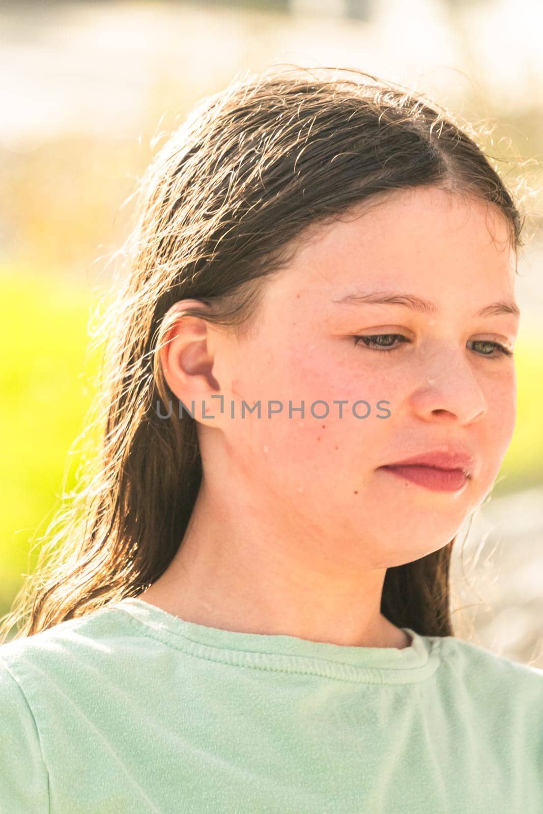 Little Girl Enjoying Water Mist on a Summer Day by arinahabich