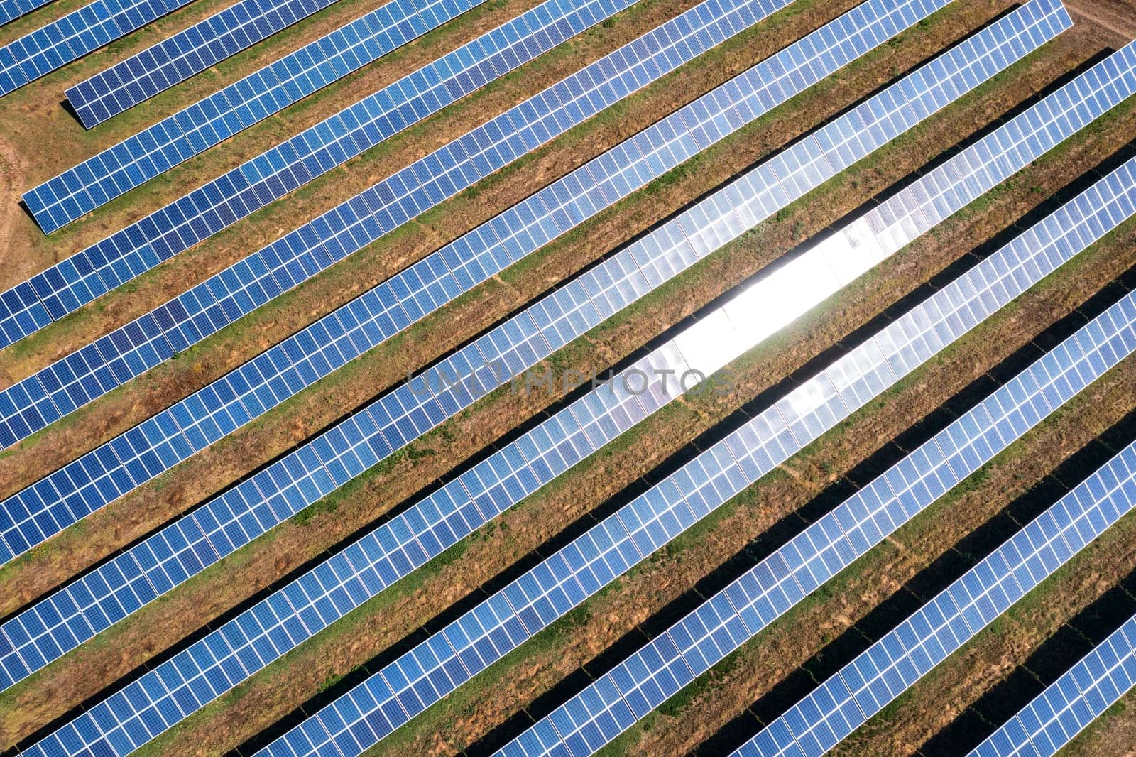 Aerial top view from drone of a field of solar panels