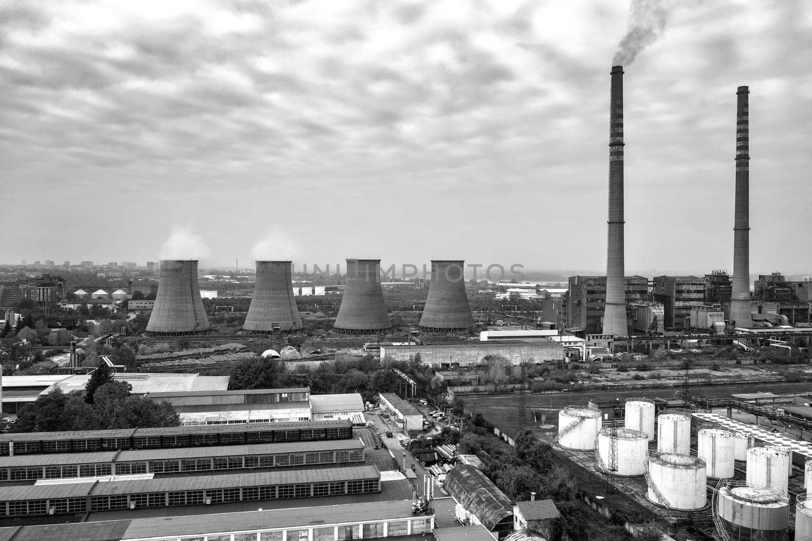 A black and white view of Coal Power Plant with large Chimneys 