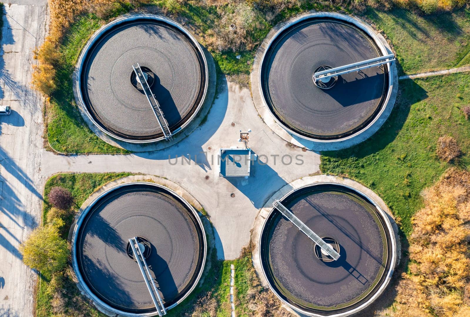 Aerial top view of a sewage treatment plant. A group from the big sedimentation drainage.