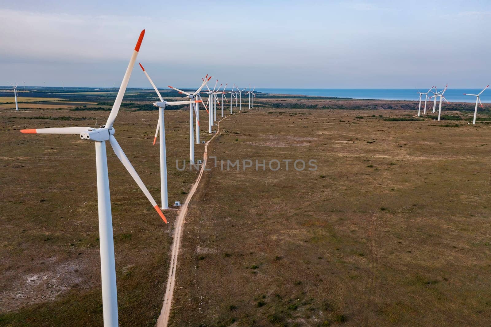 Aerial view of a row of wind turbines. Horizontal view by EdVal