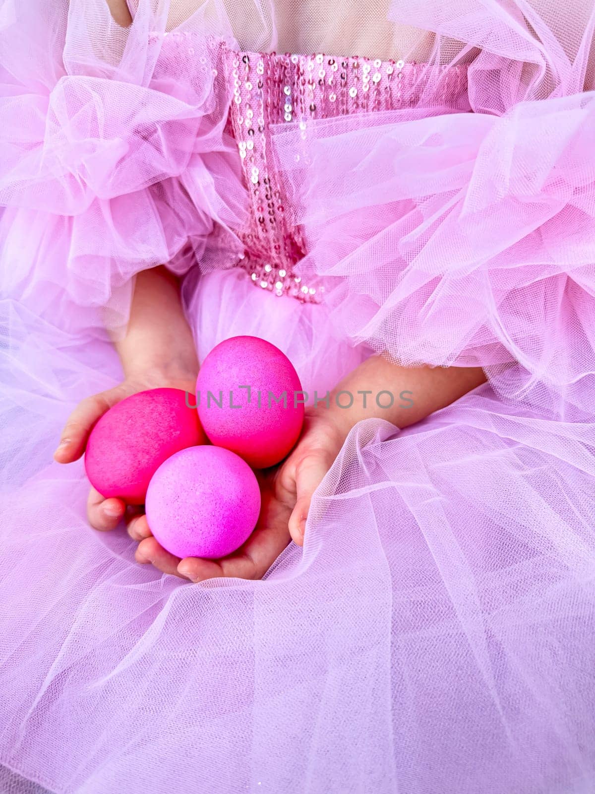 Child in pink tulle dress holding bright pink eggs, Easter celebration concept with a playful and festive feel. For Easter related marketing materials, event invitations, childrens party advertisements. by Lunnica