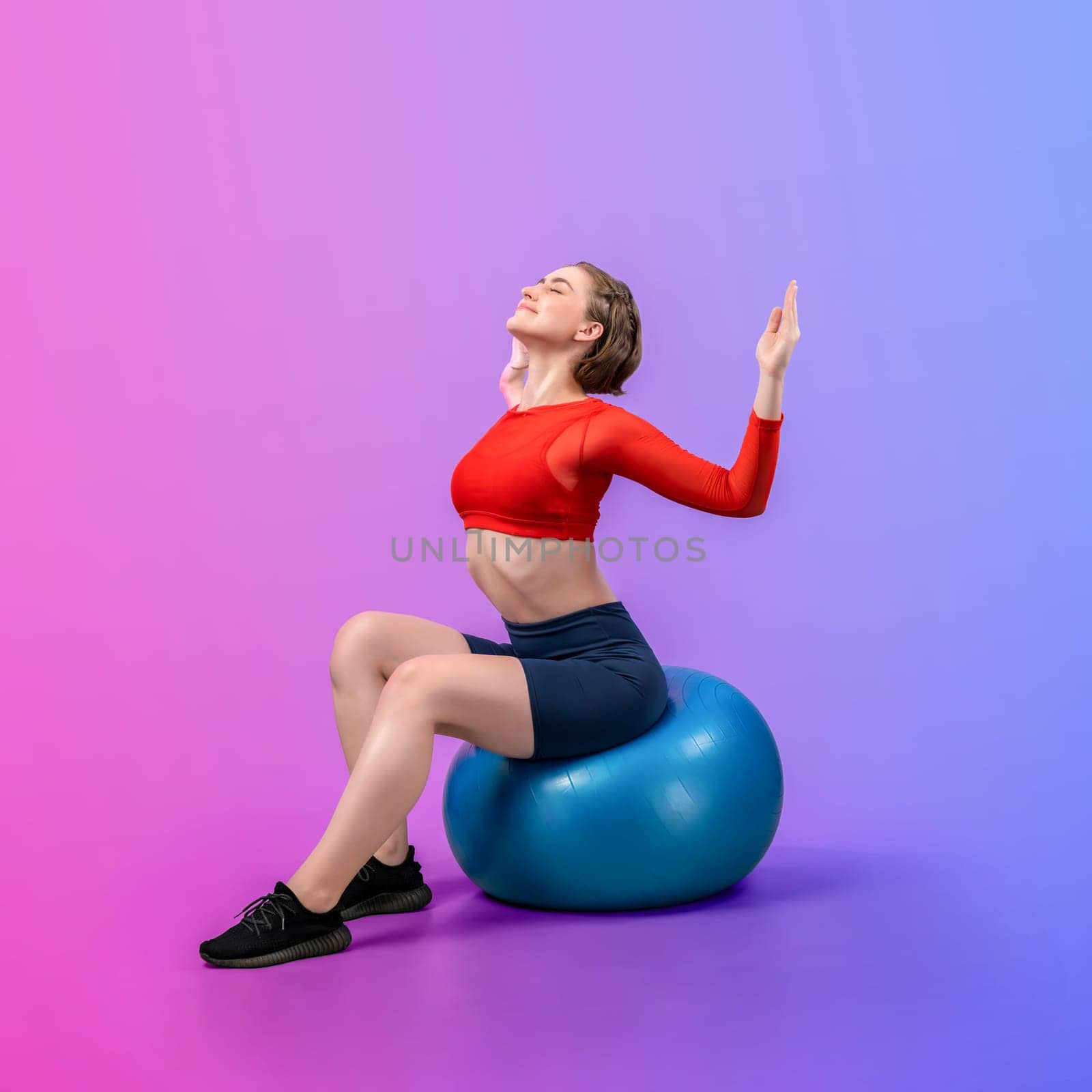 Full body length gaiety shot athletic and sporty young woman with fitness exercising ball in standing posture on isolated background. Healthy active and body care lifestyle.