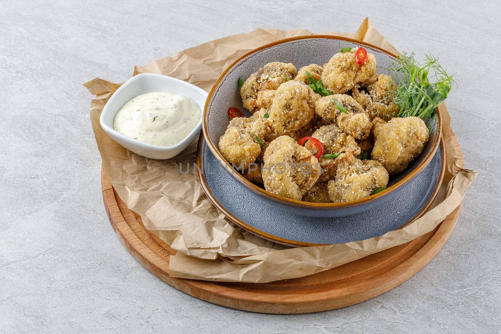 mushrooms in batter on a stone background studio food photo 4