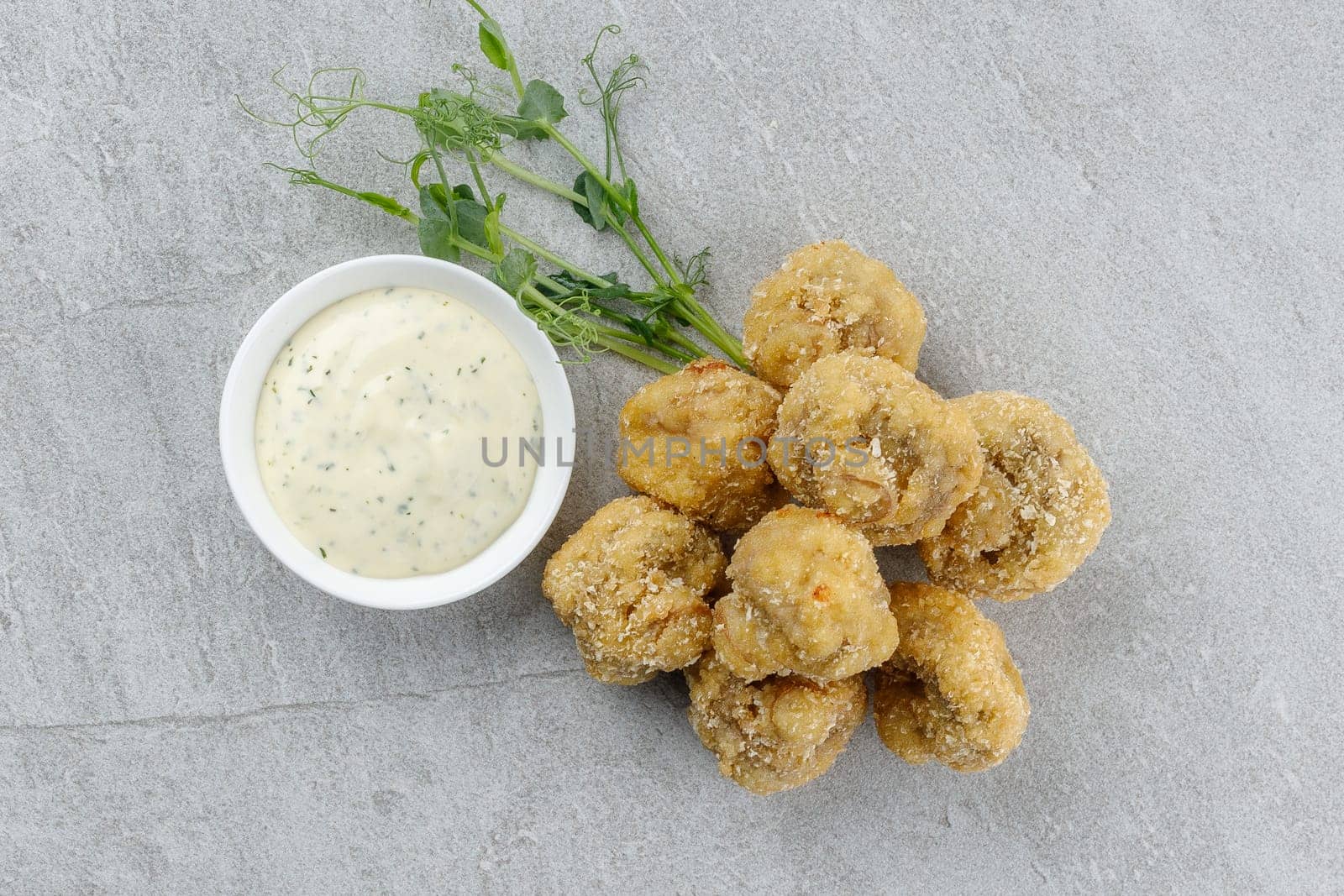 mushrooms in batter on a stone background studio food photo 1