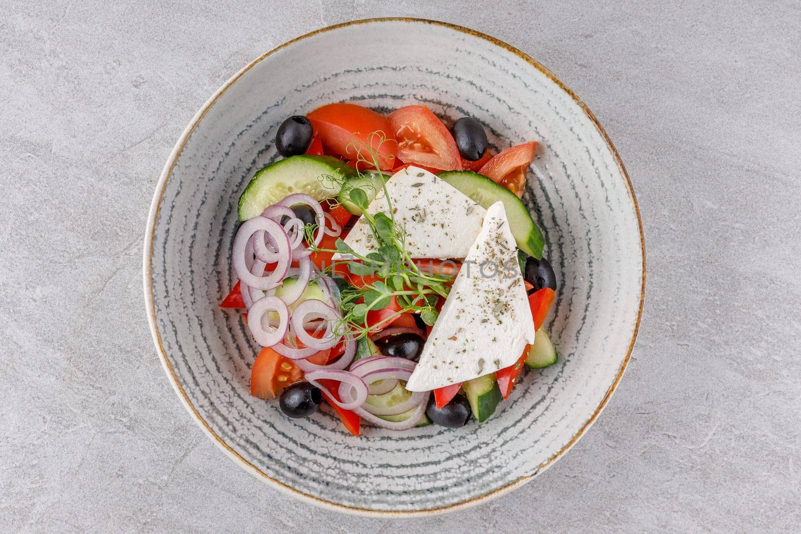 Greek salad on a stone background studio food photo 6
