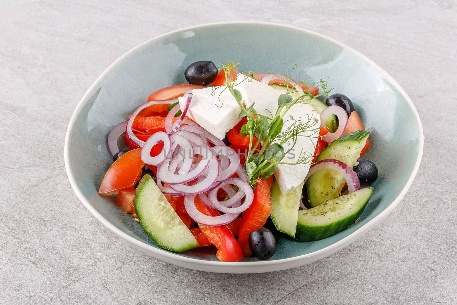 Greek salad on a stone background studio food photo