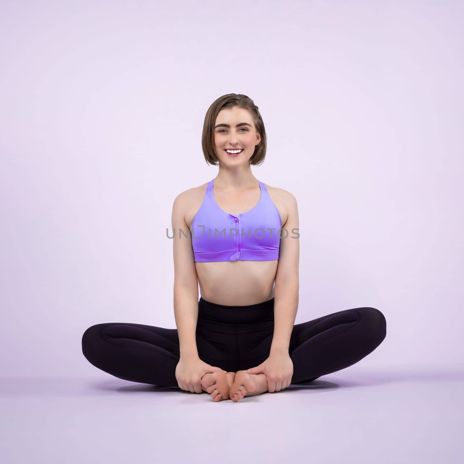 Full body length gaiety shot athletic and sporty woman doing yoga by biancoblue