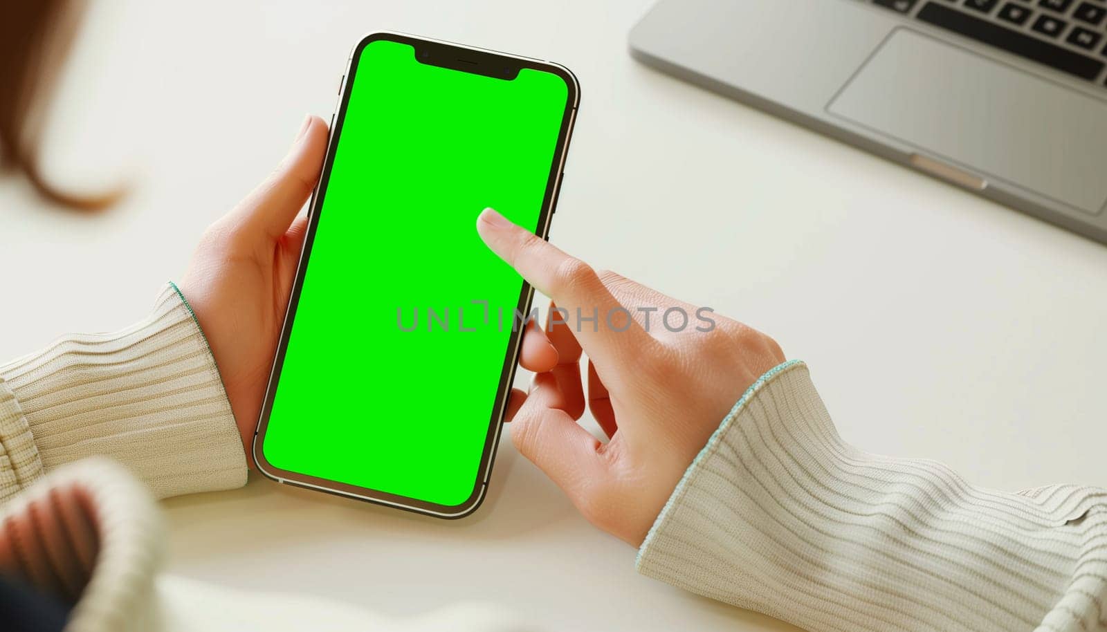 Mockup image of a business people holding smart mobile phone with blank green screen by sarymsakov