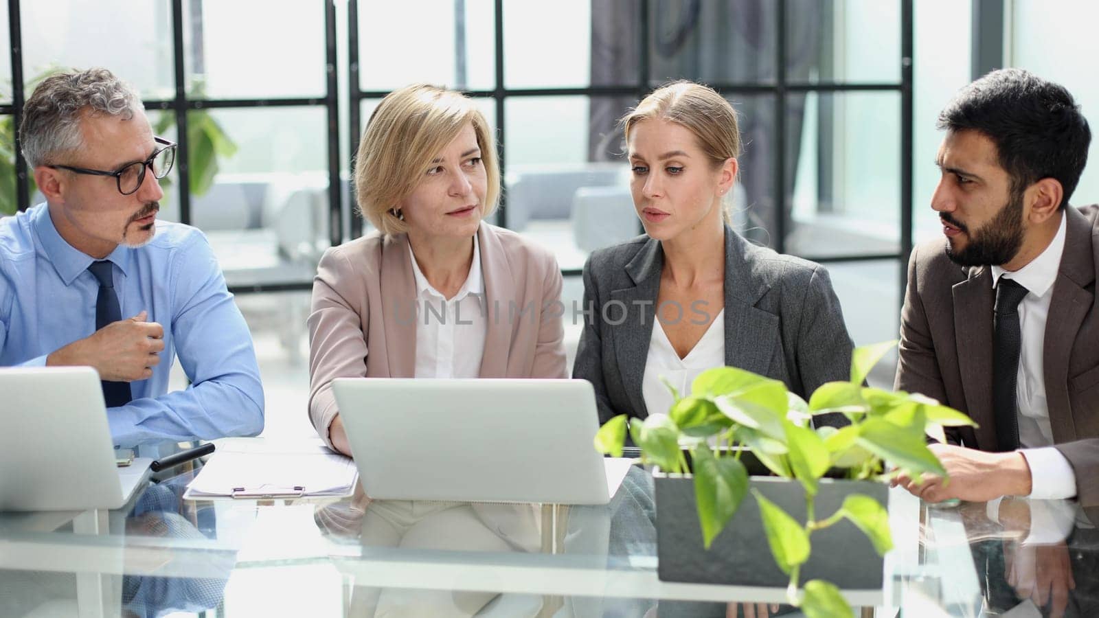 Portrait of creative business team using laptop by Prosto