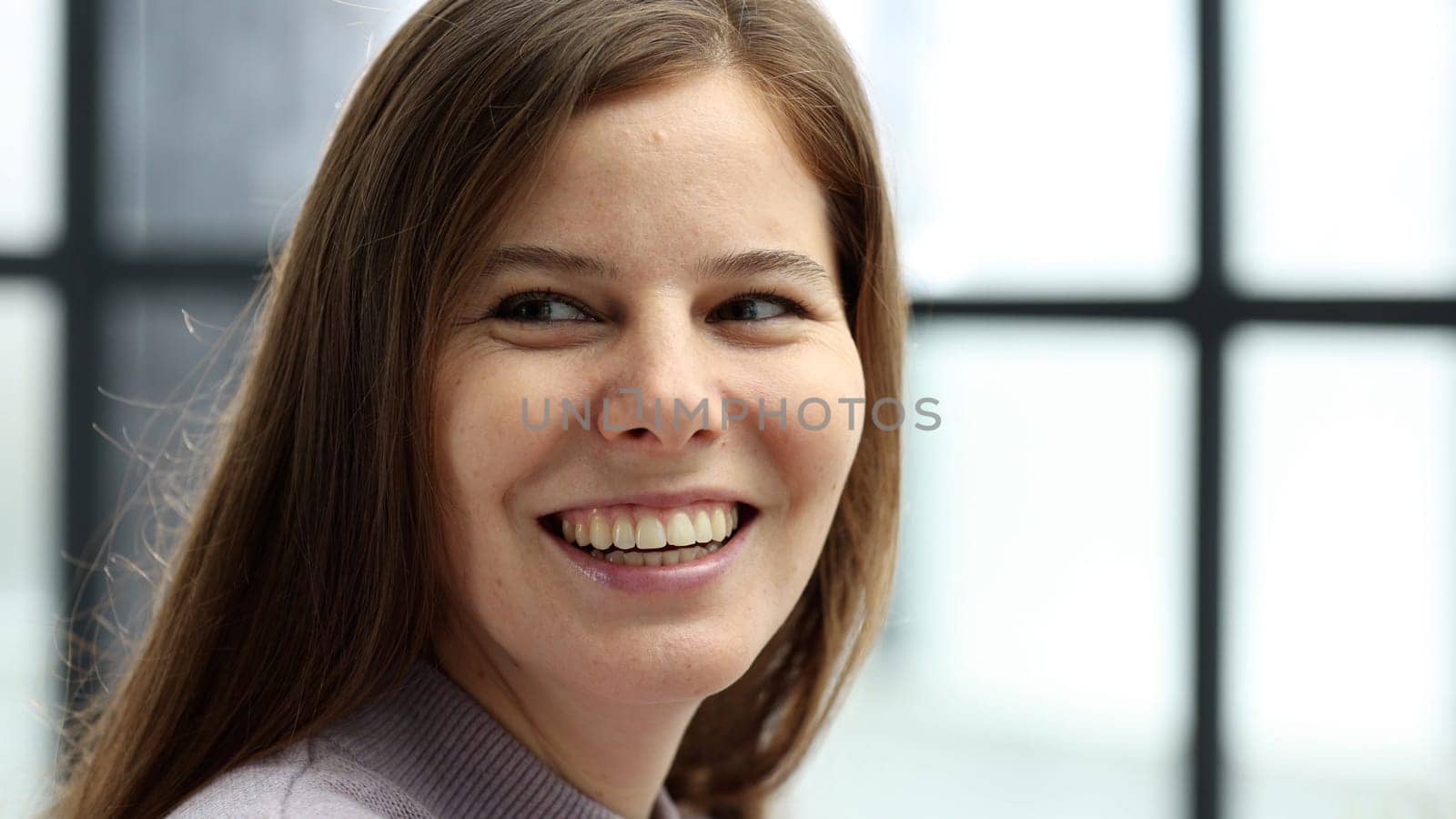 Close-up of a woman's face in the office.