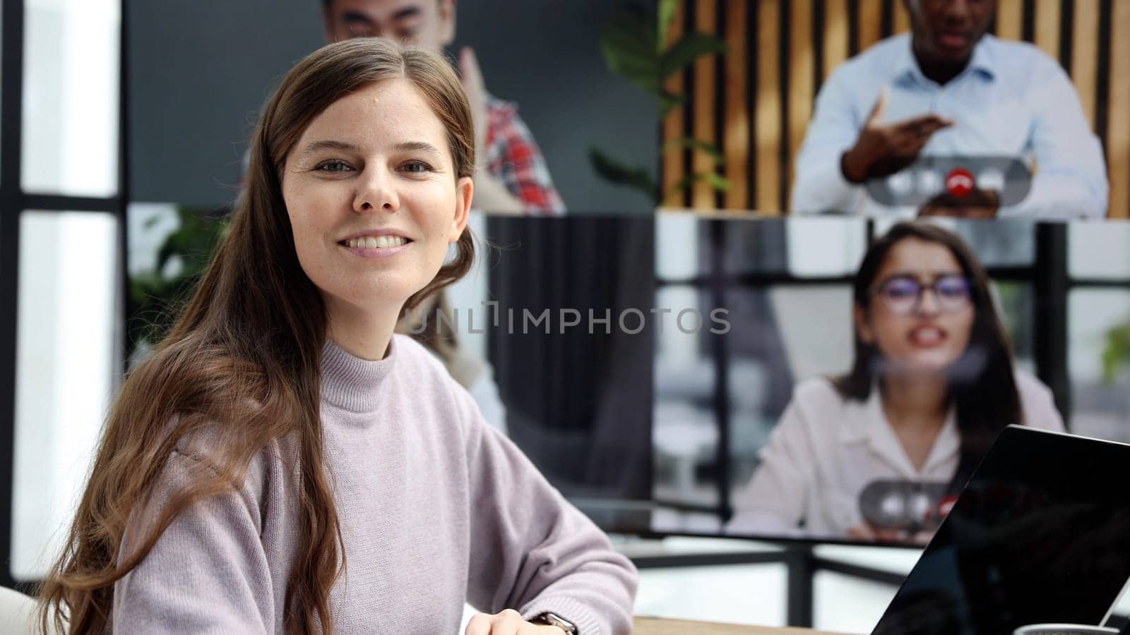Close-up of a woman in the office at an online business meeting by Prosto