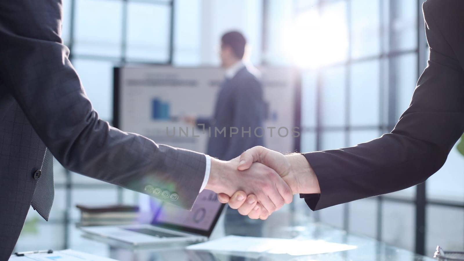 Congratulations and handshake at a successful business meeting.