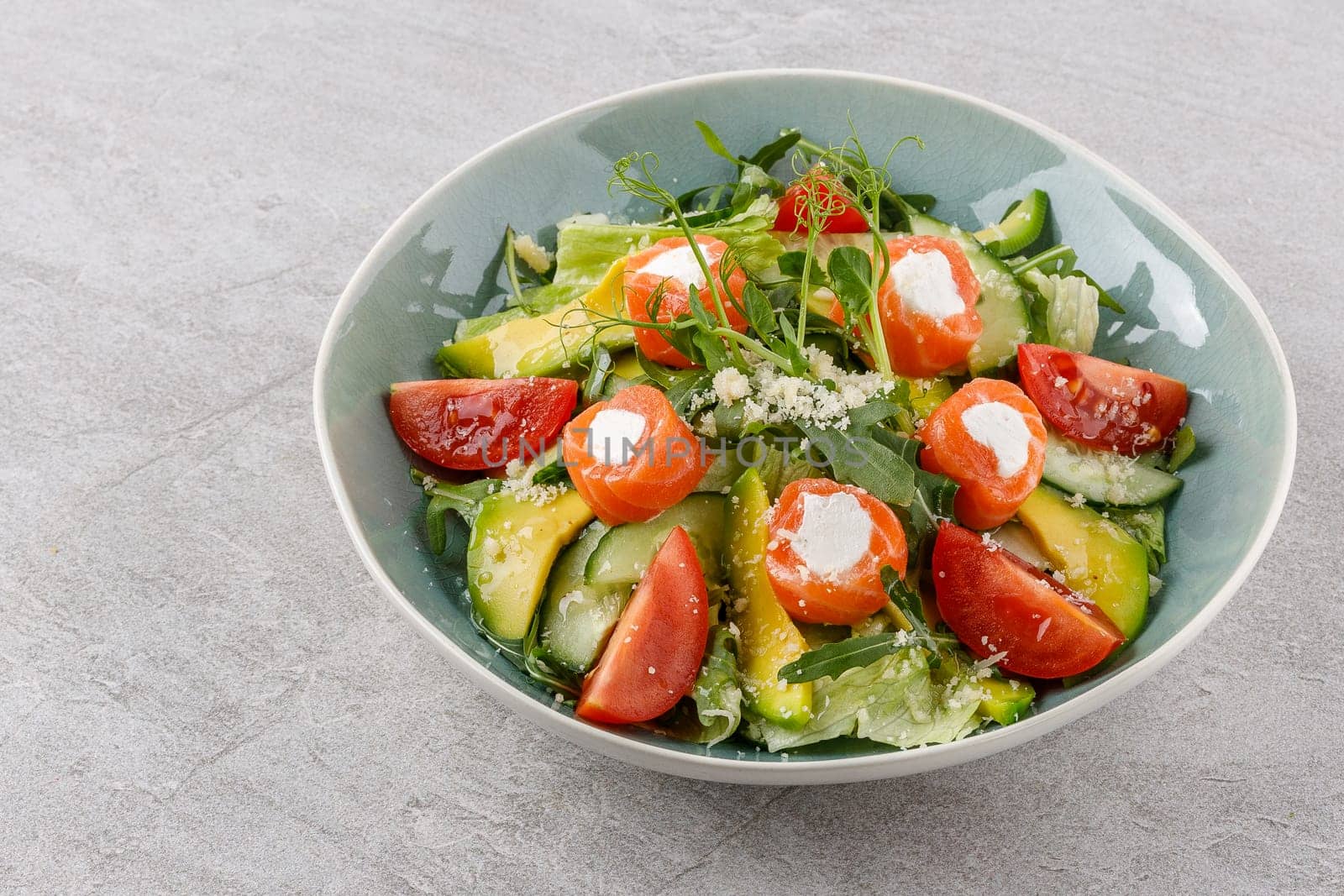 salad with salmon and cream cheese on a stone background studio food photo 1