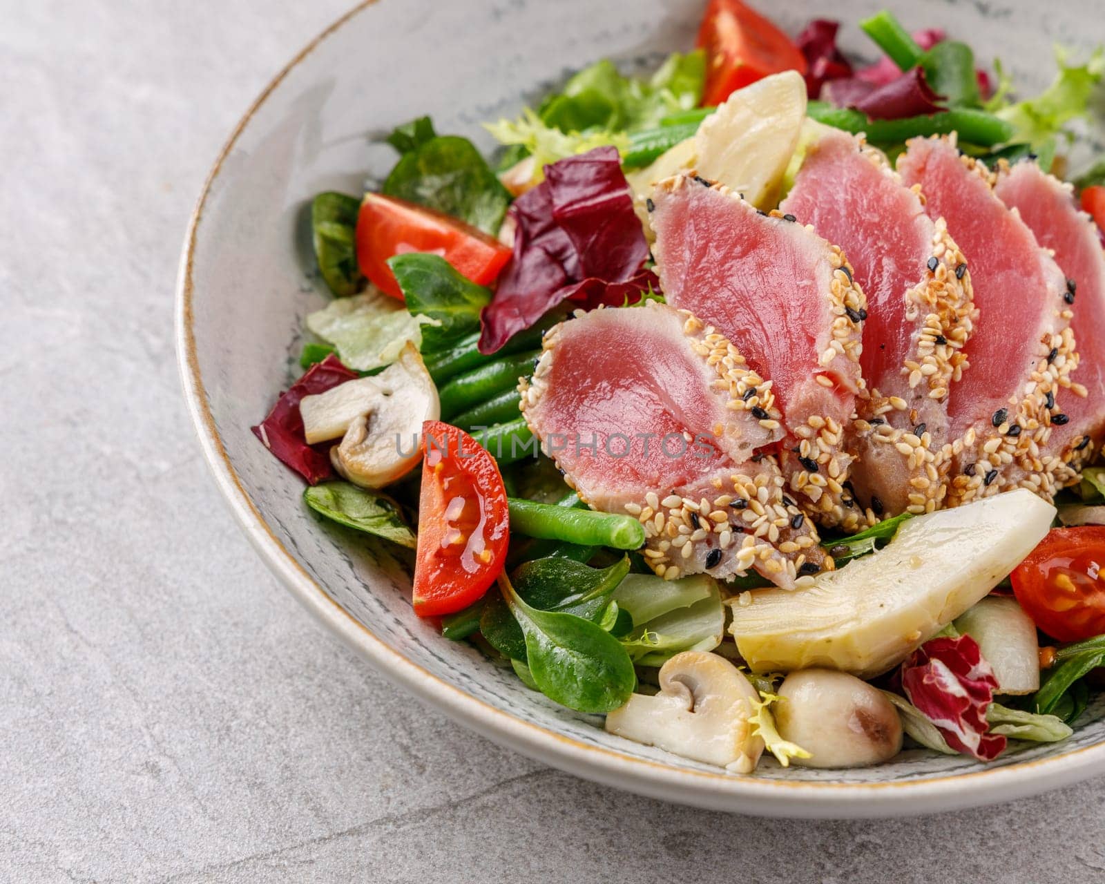 Tuna and artichoke salad on a stone background studio food photo 2