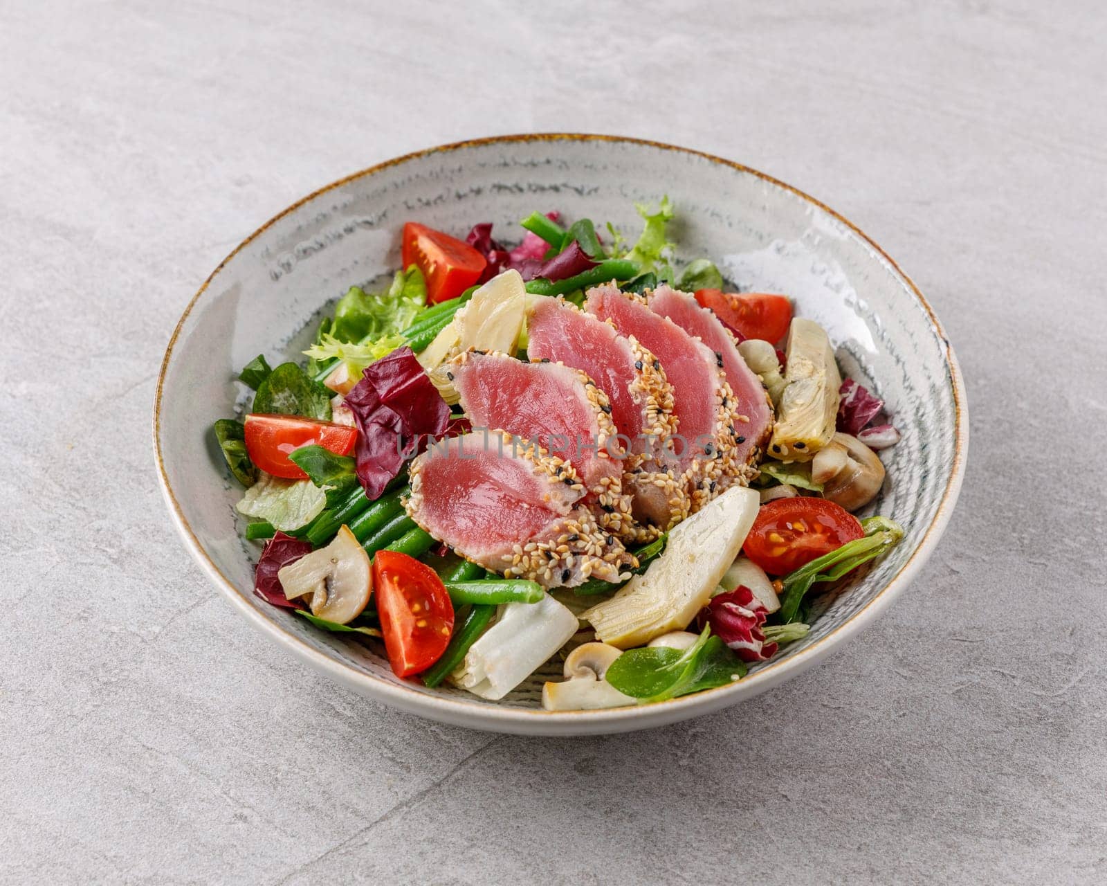 Tuna and artichoke salad on a stone background studio food photo 3