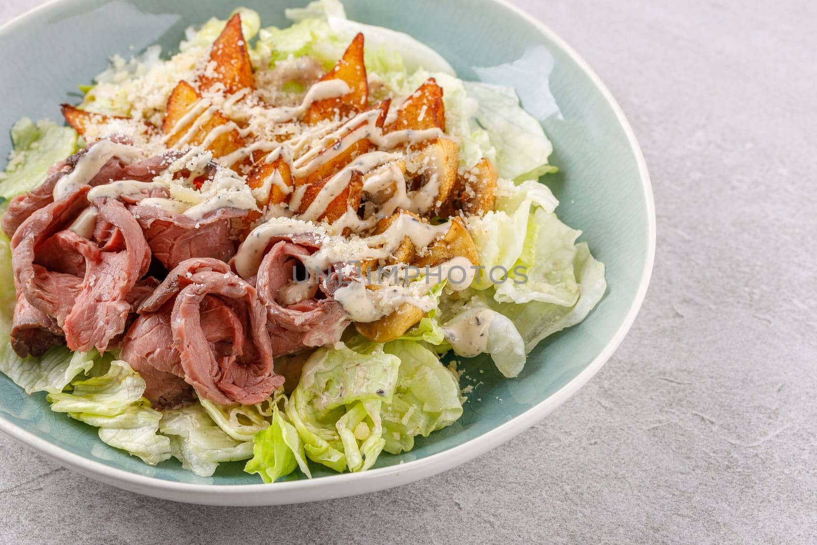 Salad with roast beef and potatoes on a stone background, studio food photo 5