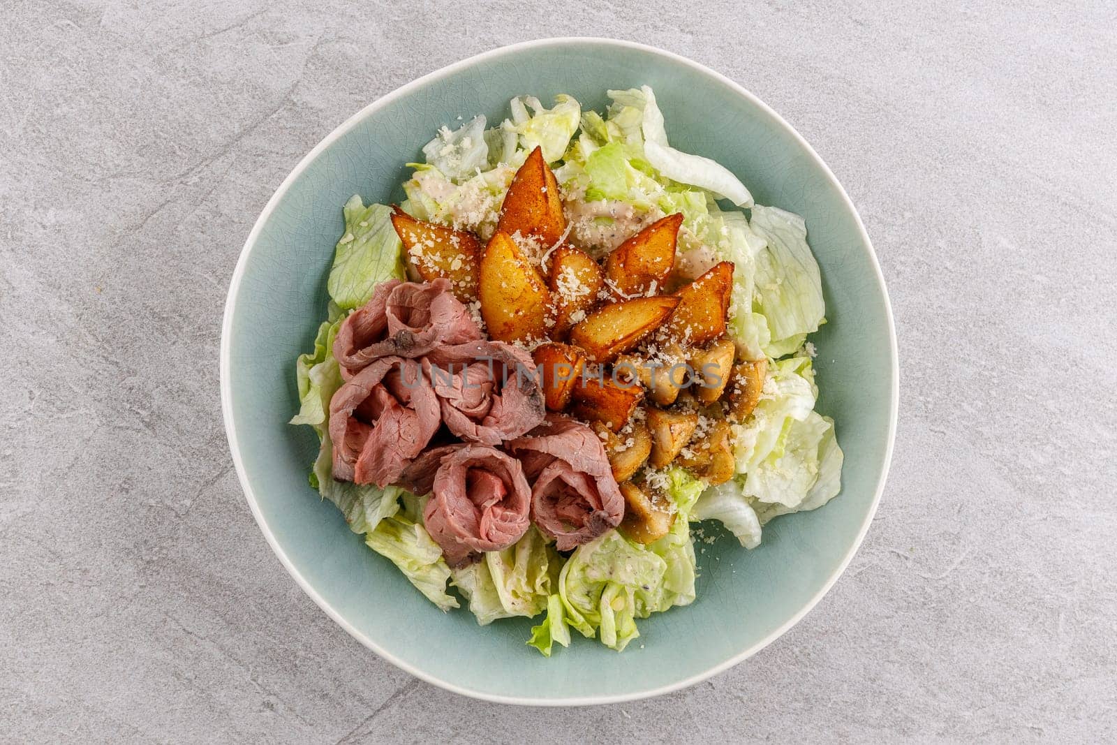 Salad with roast beef and potatoes on a stone background, studio food photo 3