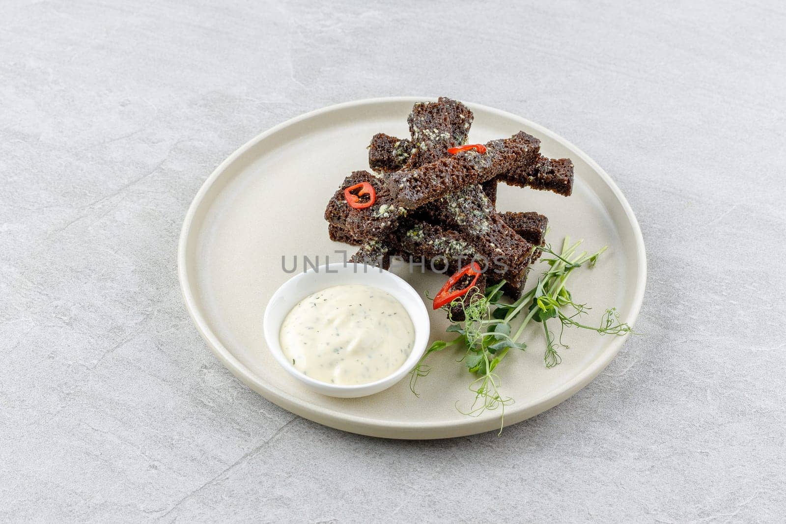 fried slices of black bread on a stone background studio food photo 5