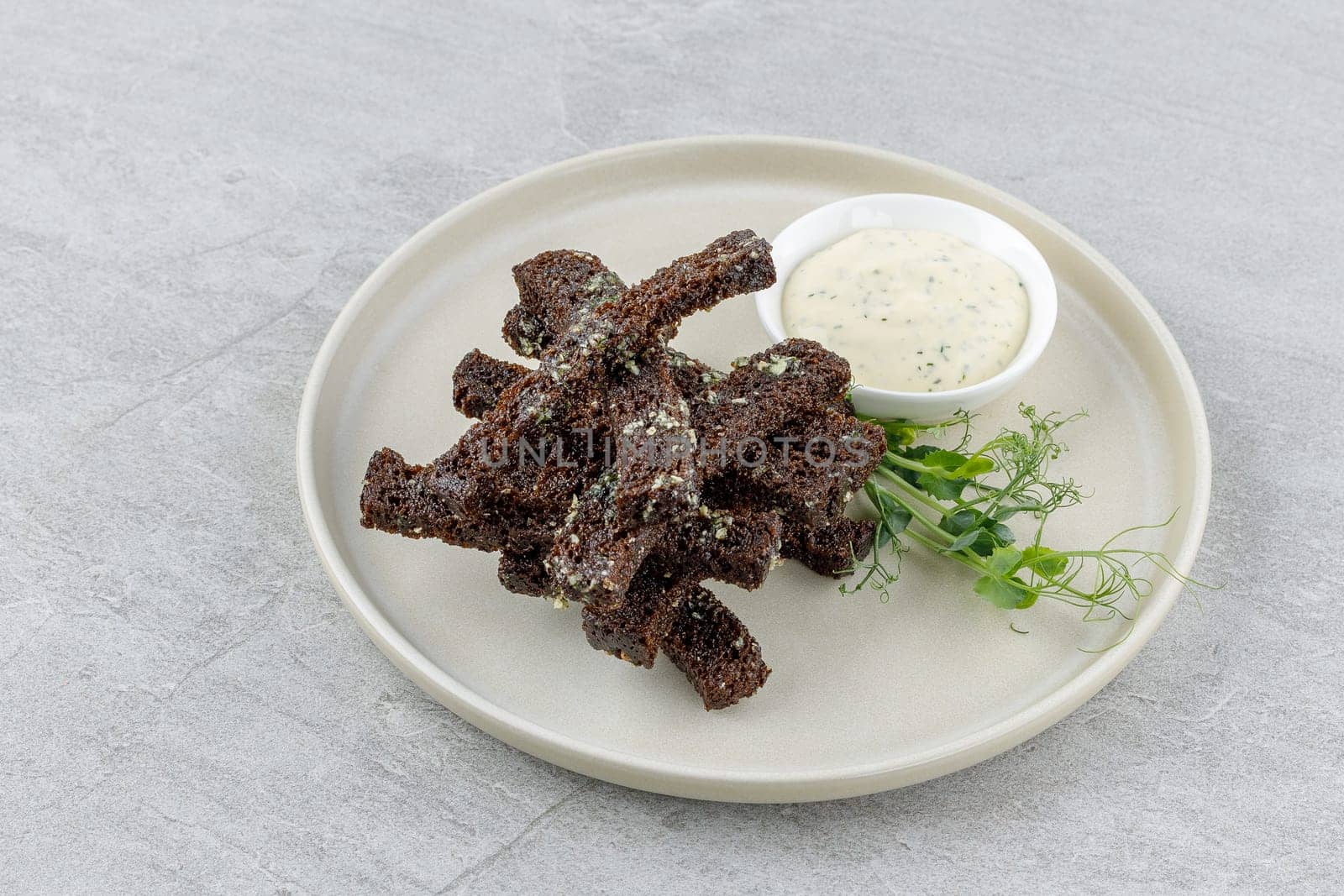 fried slices of black bread on a stone background studio food photo 3