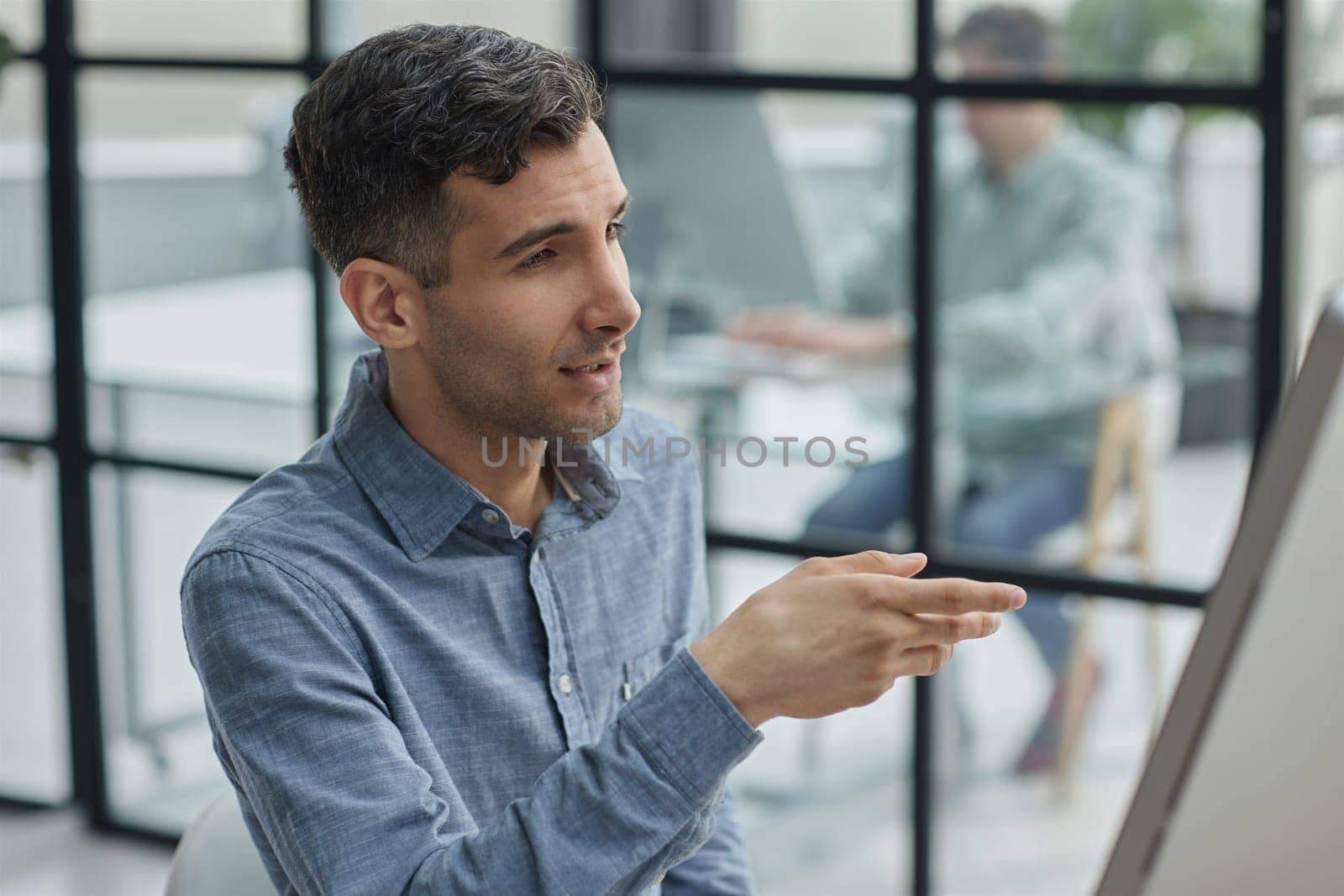 Happy businessman connecting with his team online