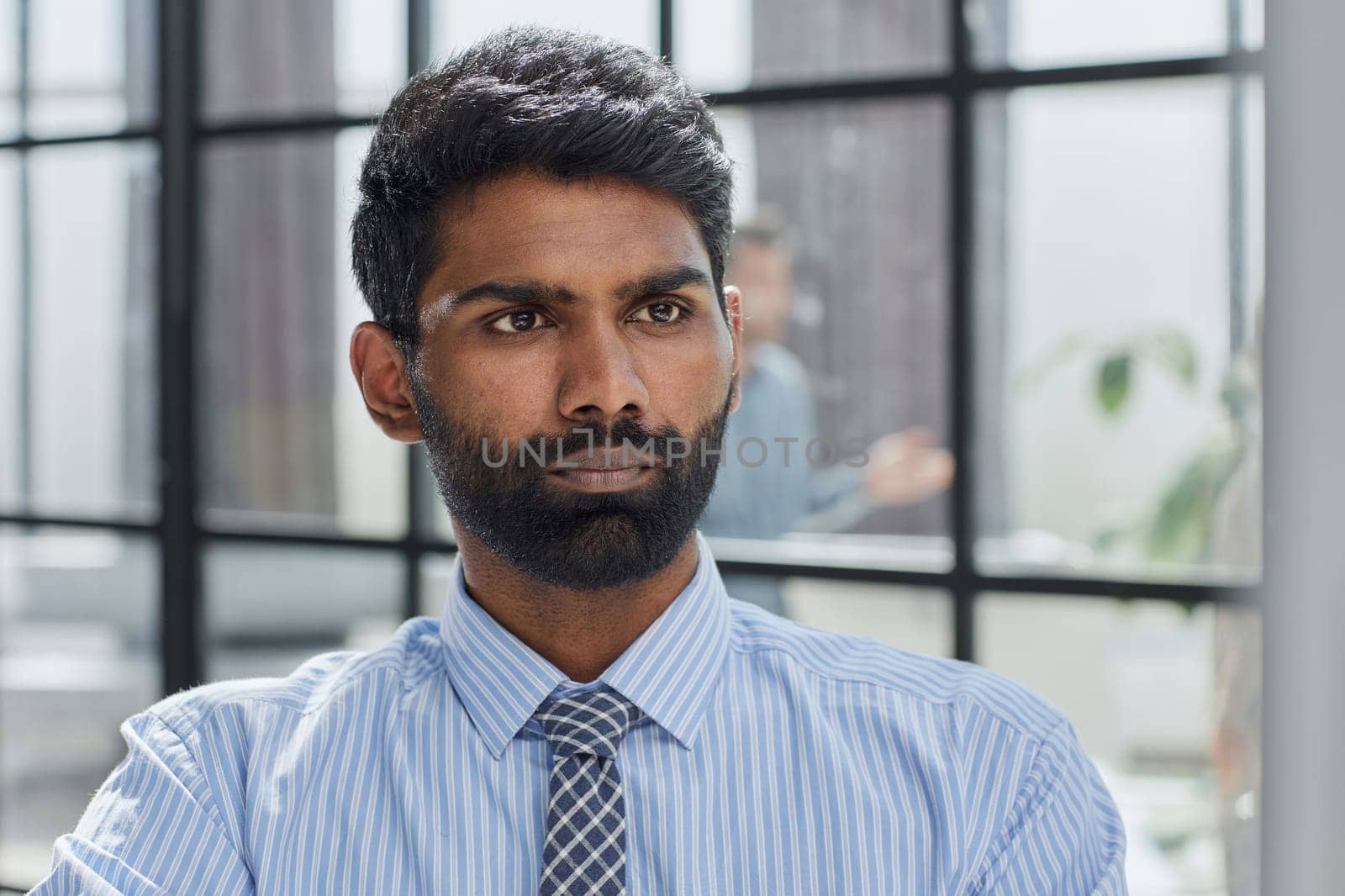 A pensive businessman working on laptop computer by Prosto