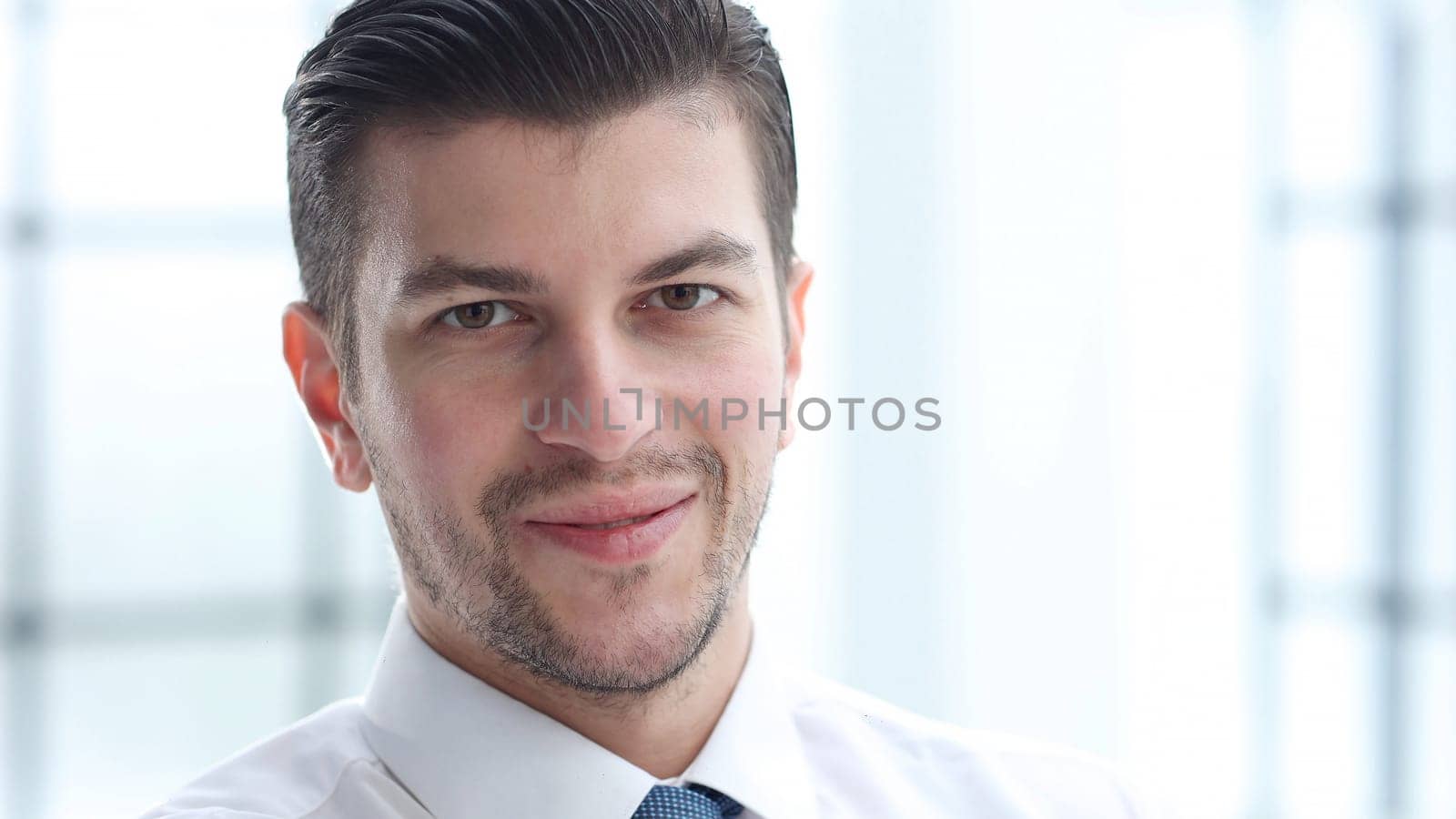 A businessman man working in the office in close-up.