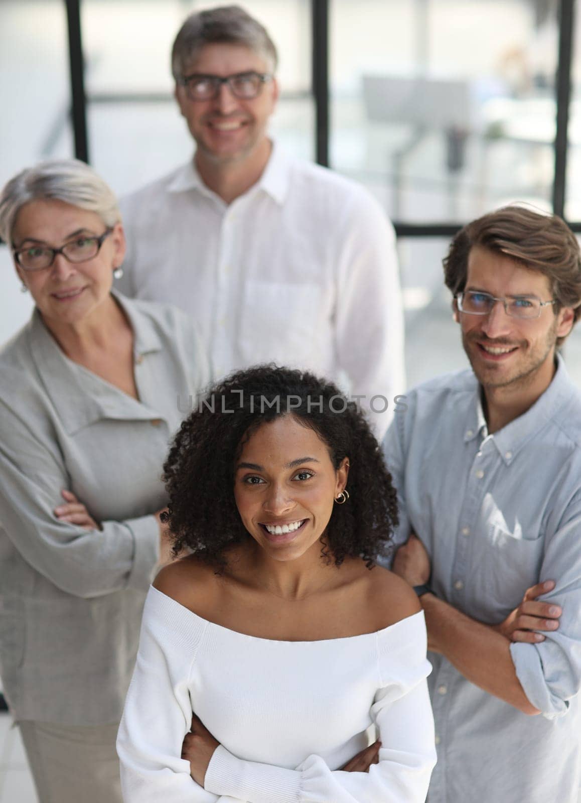 Negotiations in the office. Smiling businesswoman talks with colleagues by Prosto