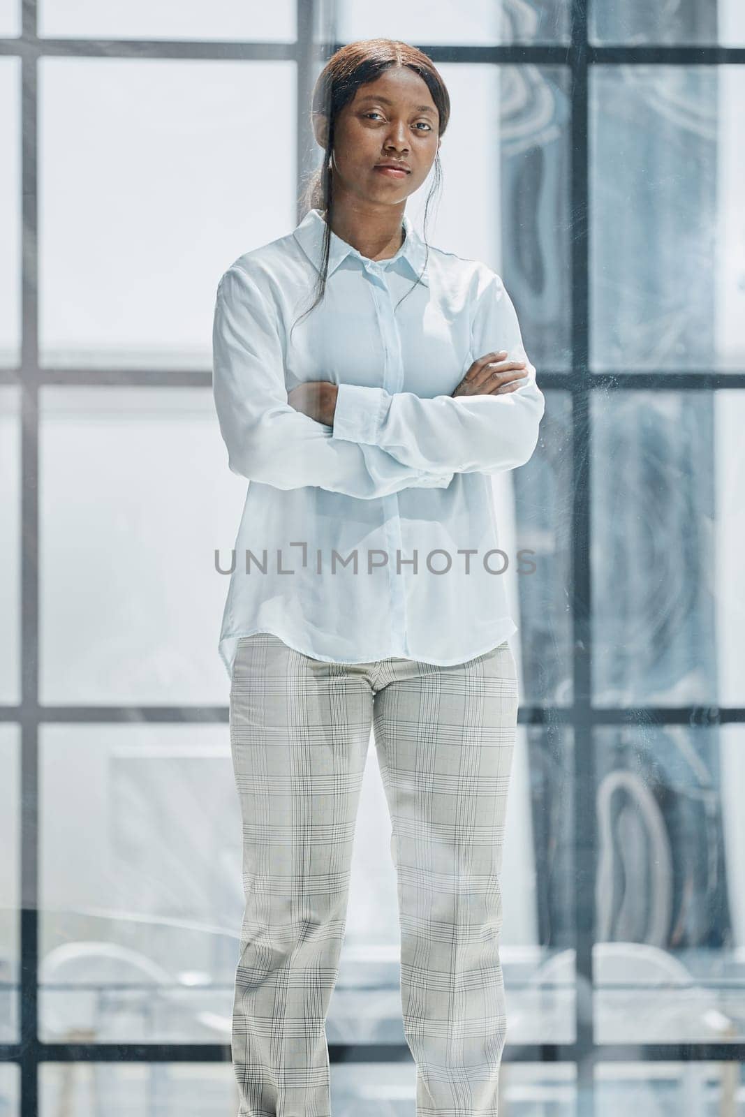 young african american young woman sitting in her chair smiling
