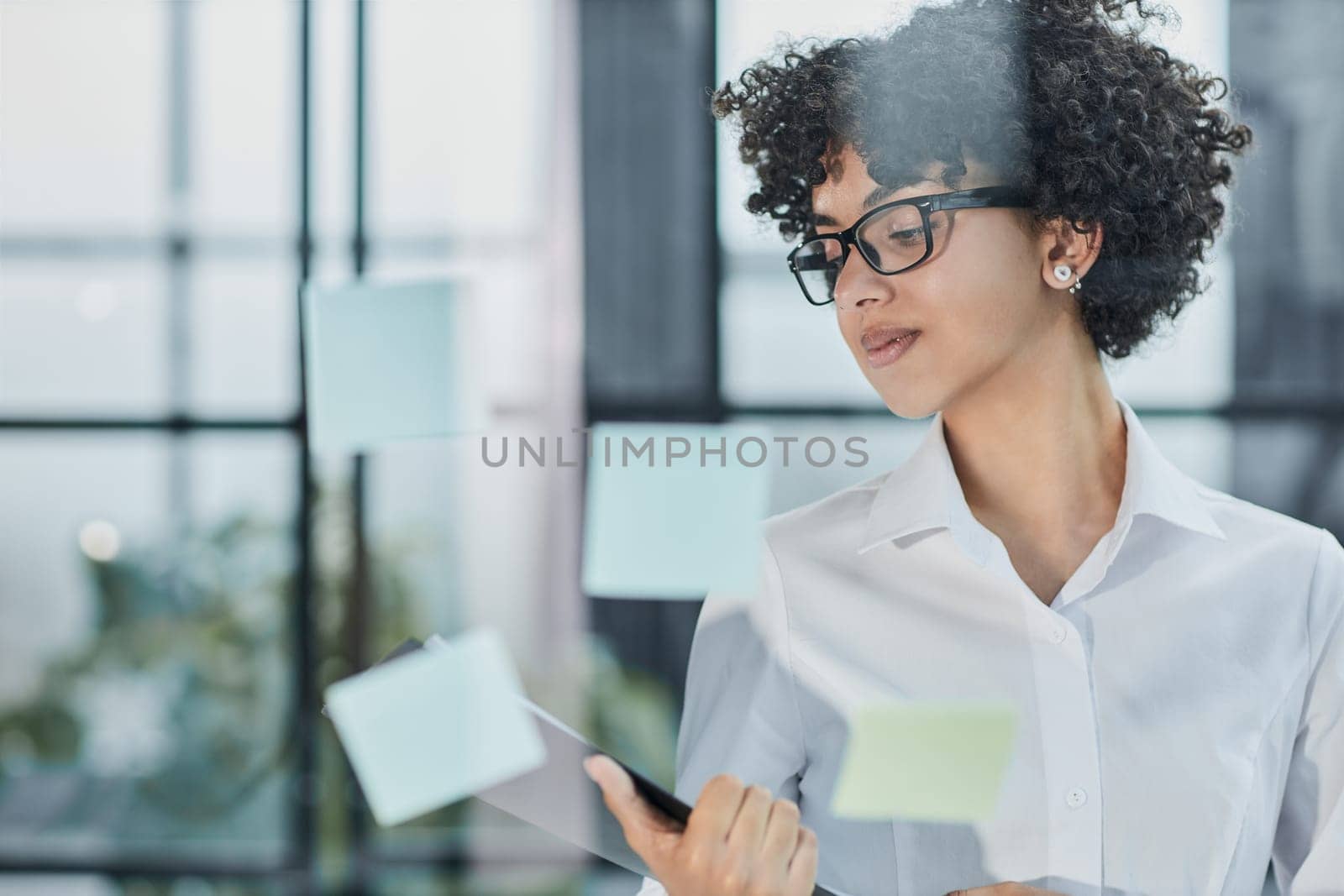 business woman mentor leader write tasks creative ideas on sticky post