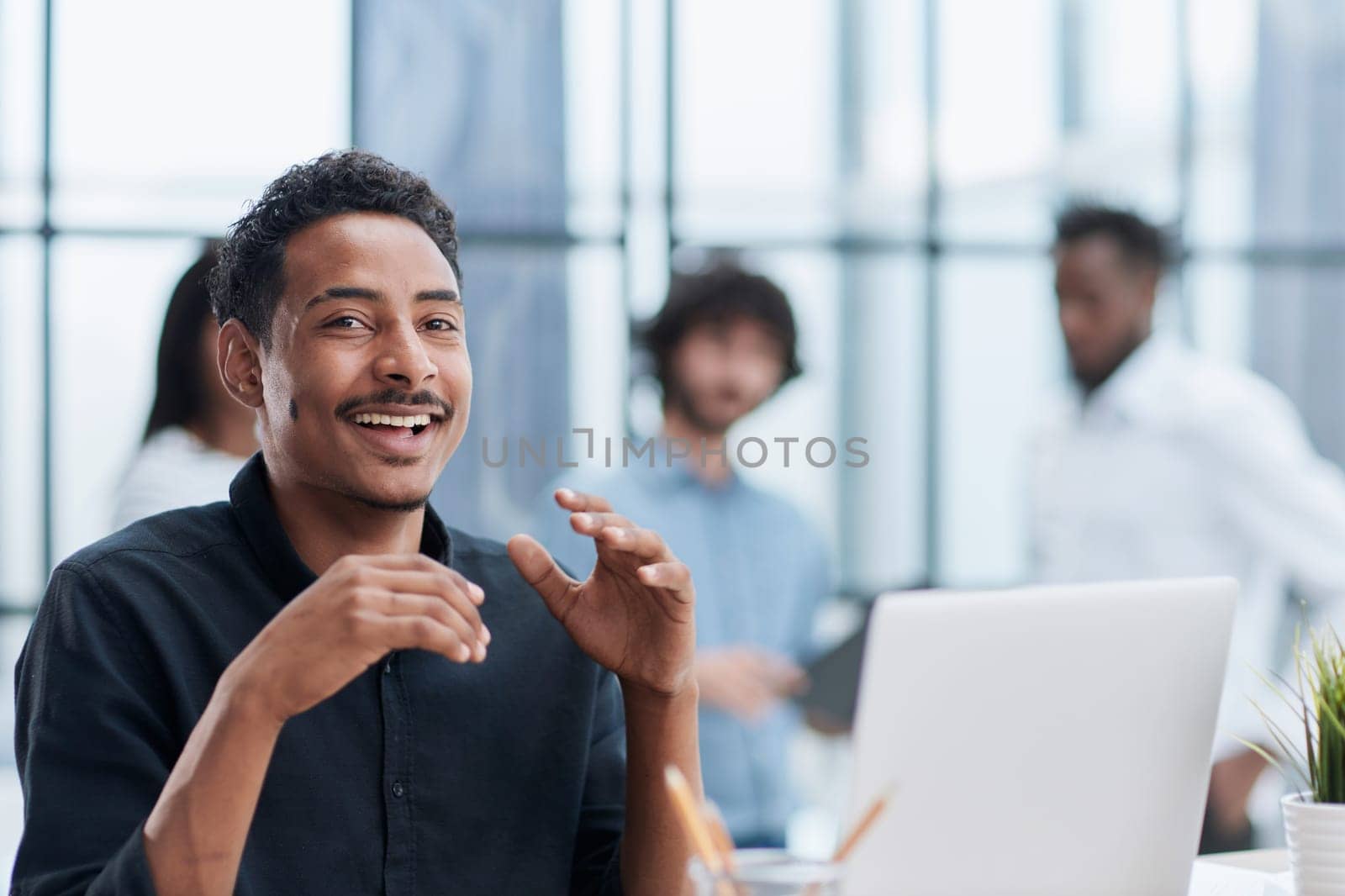 Corporate Teamwork Meeting at Office Desk with Smiling Business Professionals by Prosto