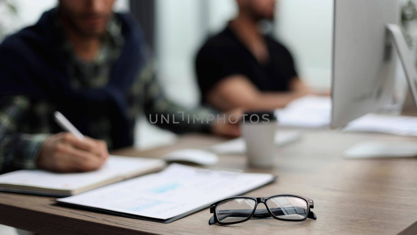 Close-up A businessman working in a private room, He is typing on a laptop keyboard. by Prosto