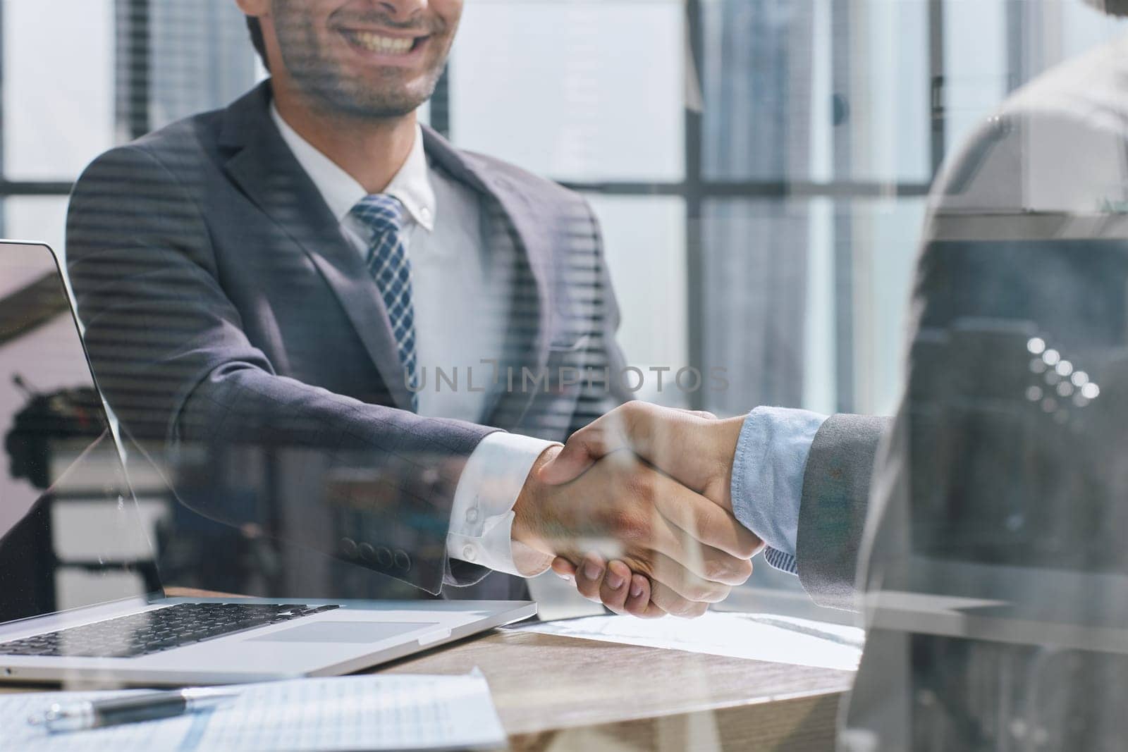 Close up of handshake in the office