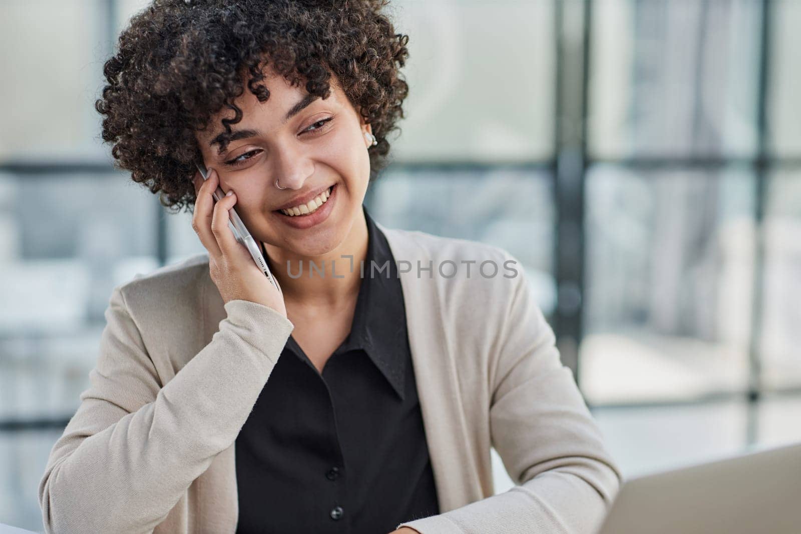 Image of young beautiful joyful woman smiling while working with laptop in office