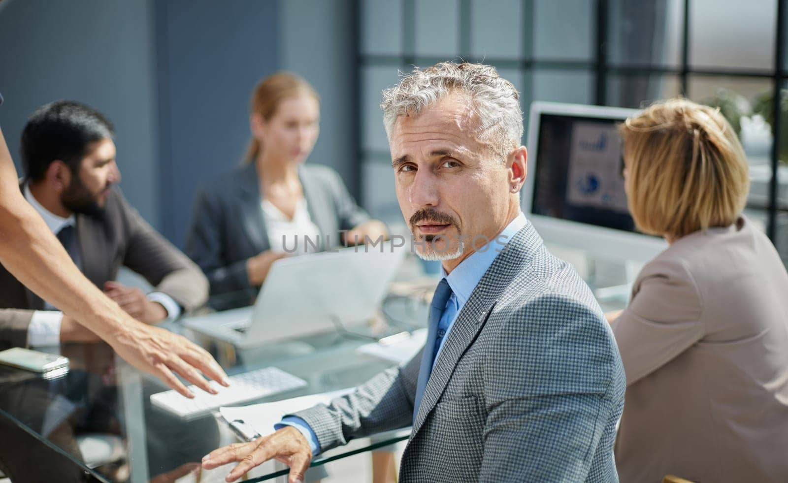 Confident male boss work cooperate with diverse team at office briefing by Prosto