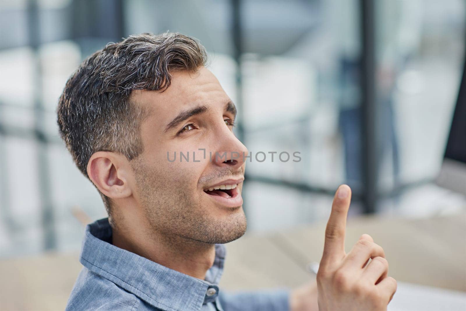 Portrait of cheerful male student enjoying learning in coworking office using laptop computer for research by Prosto